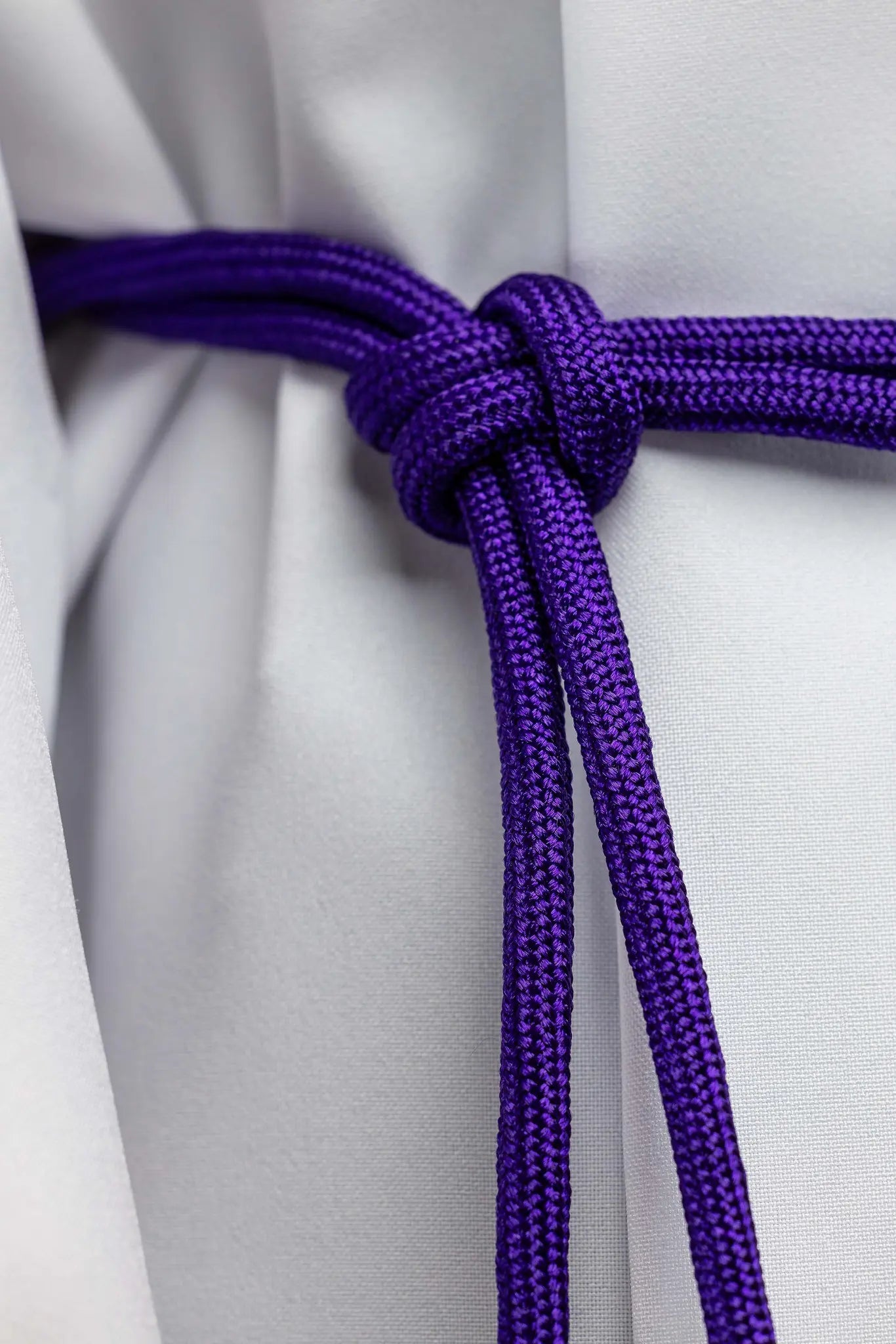 Purple braided liturgical cincture with long tassels