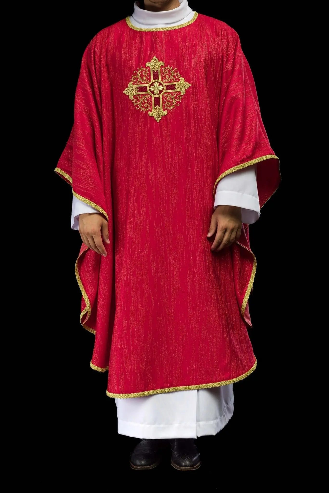 Red chasuble with embroidered cross motif on decorative fabric