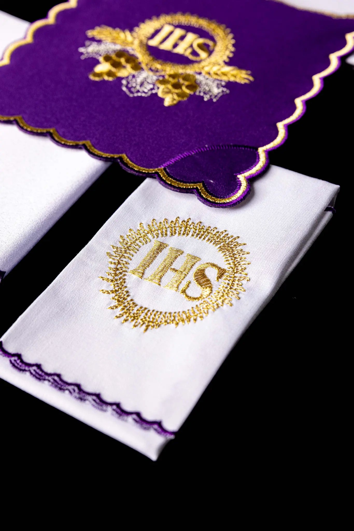 Purple chalice linen set with gold IHS embroidery on pall, corporal, purificator, and lavabo towel