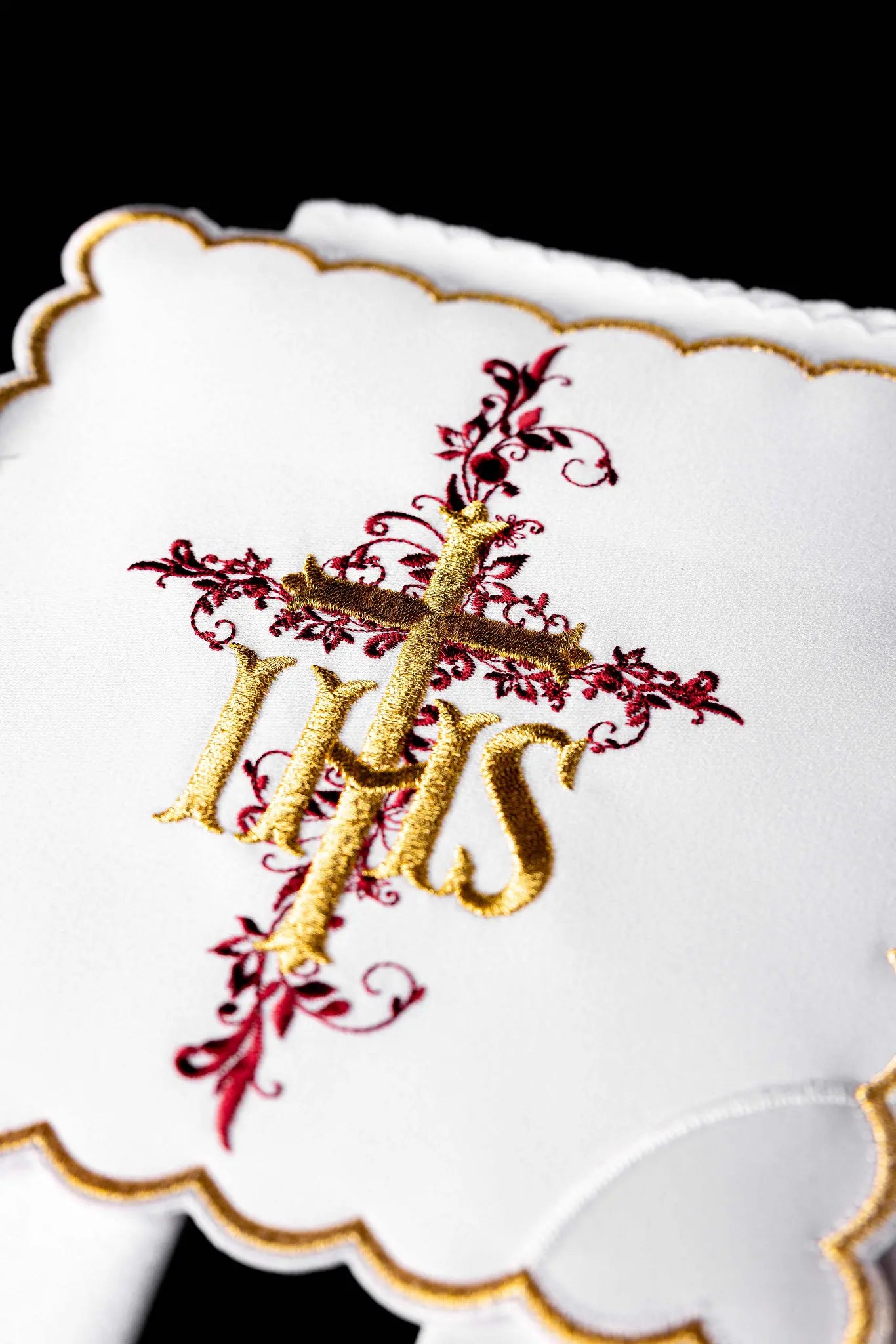 White chalice linen set with IHS embroidery, including pall, corporal, purificator, and lavabo towel.