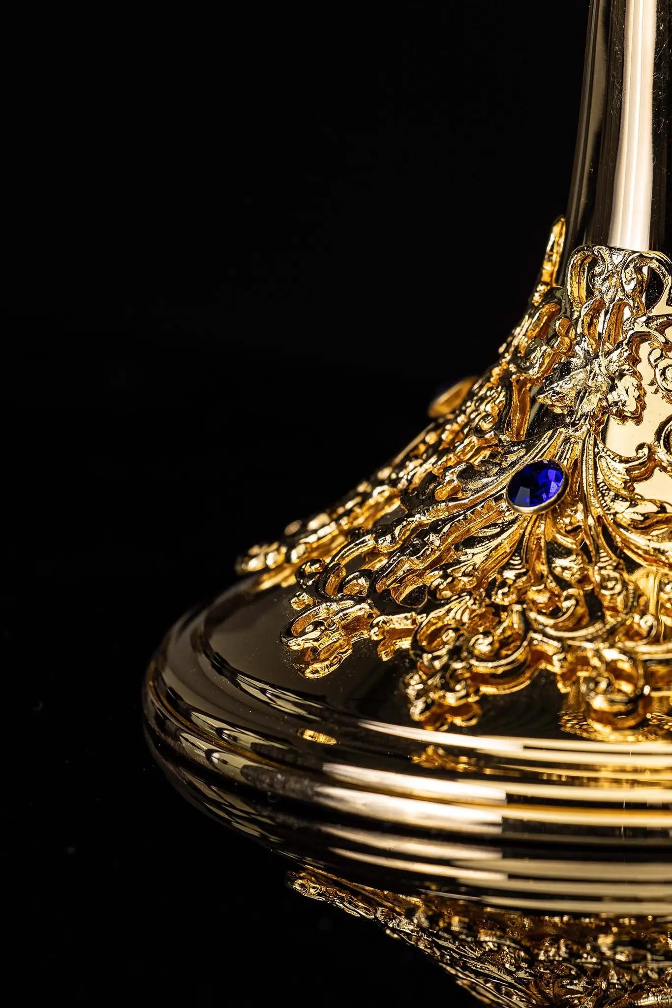 Handmade gold-plated ciborium with floral ornamentation and blue imitation sapphires, topped with a cross.