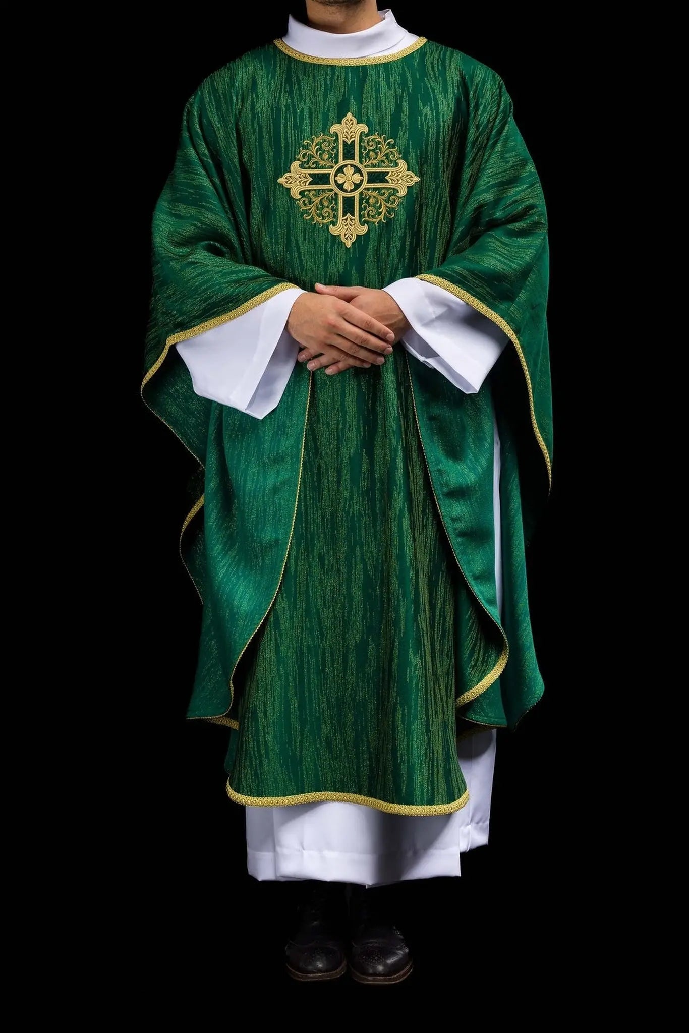 Green chasuble with an embroidered cross motif on decorative fabric