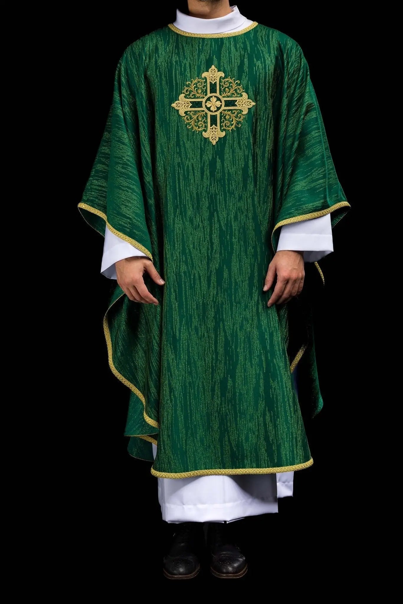 Green chasuble with an embroidered cross motif on decorative fabric