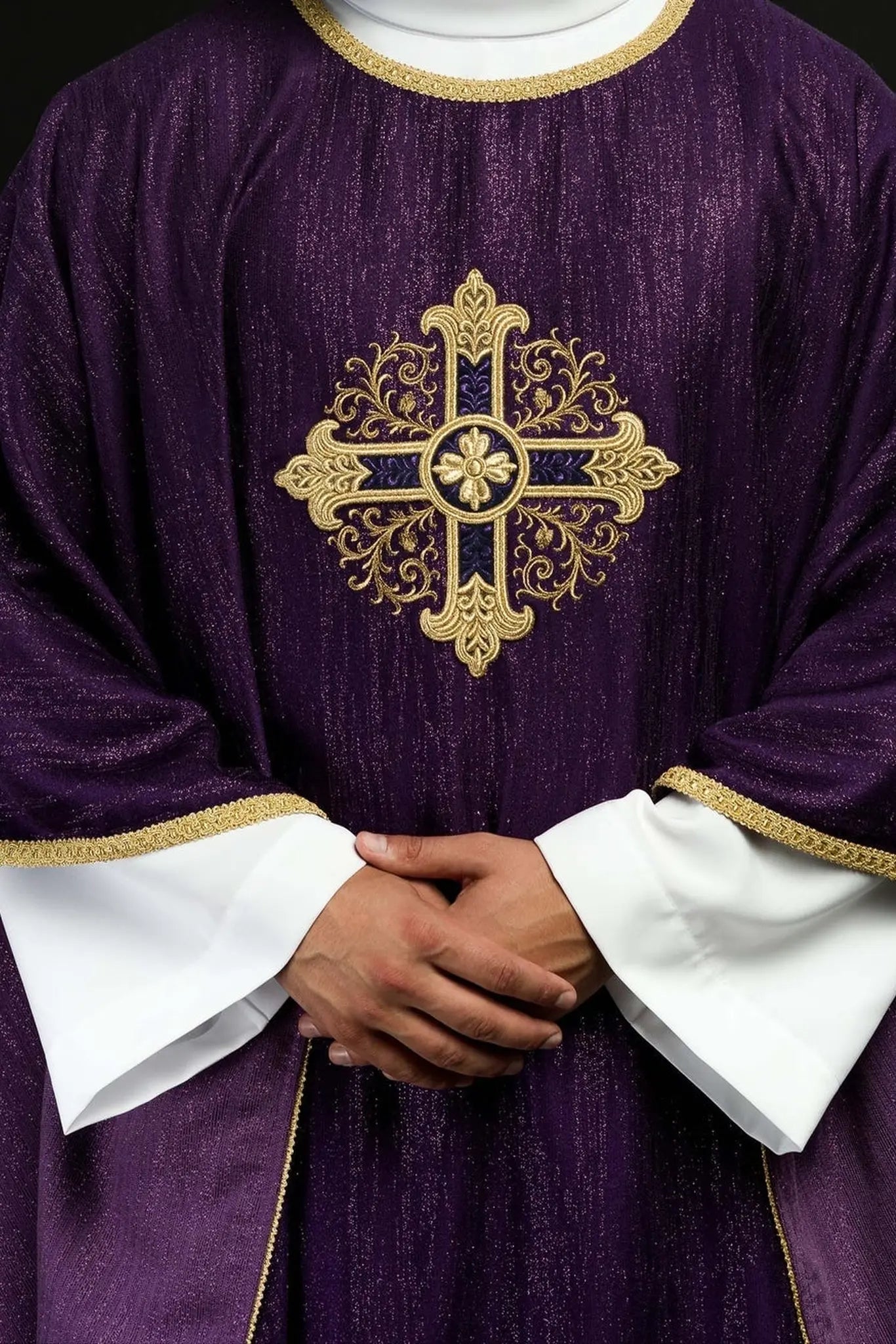 Purple liturgical chasuble with an embroidered cross motif on decorative fabric