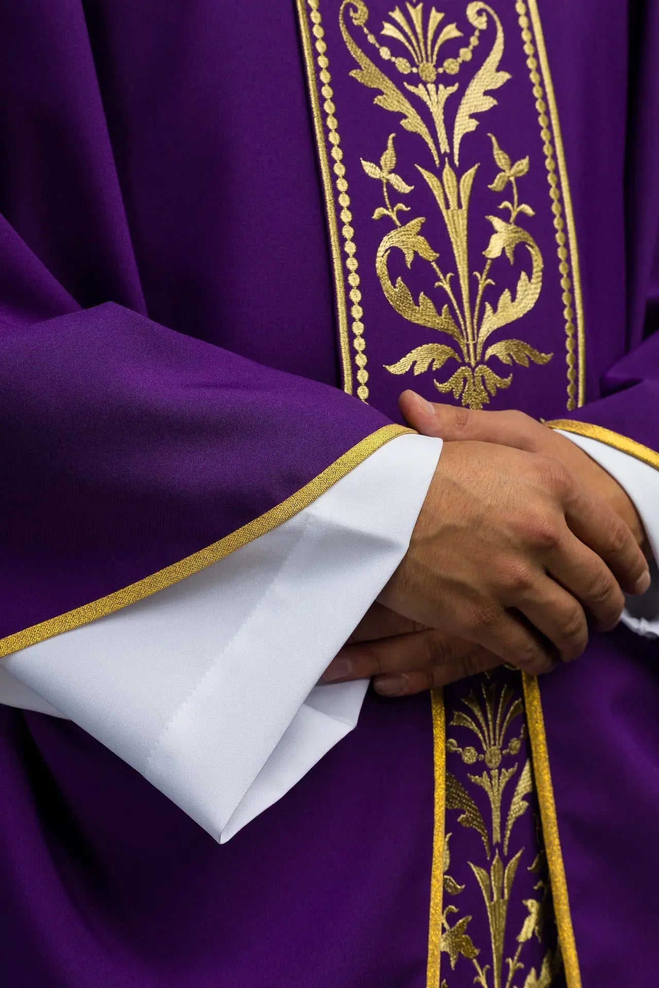 Purple liturgical chasuble decorated with gold embroidered belt