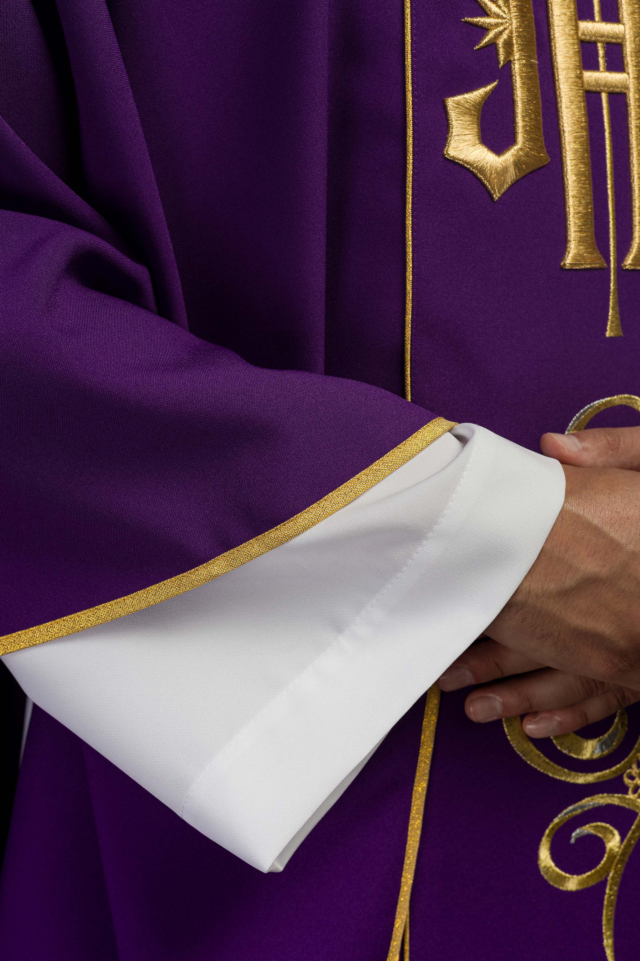 Richly decorated purple chasuble with gold motif and wide IHS band