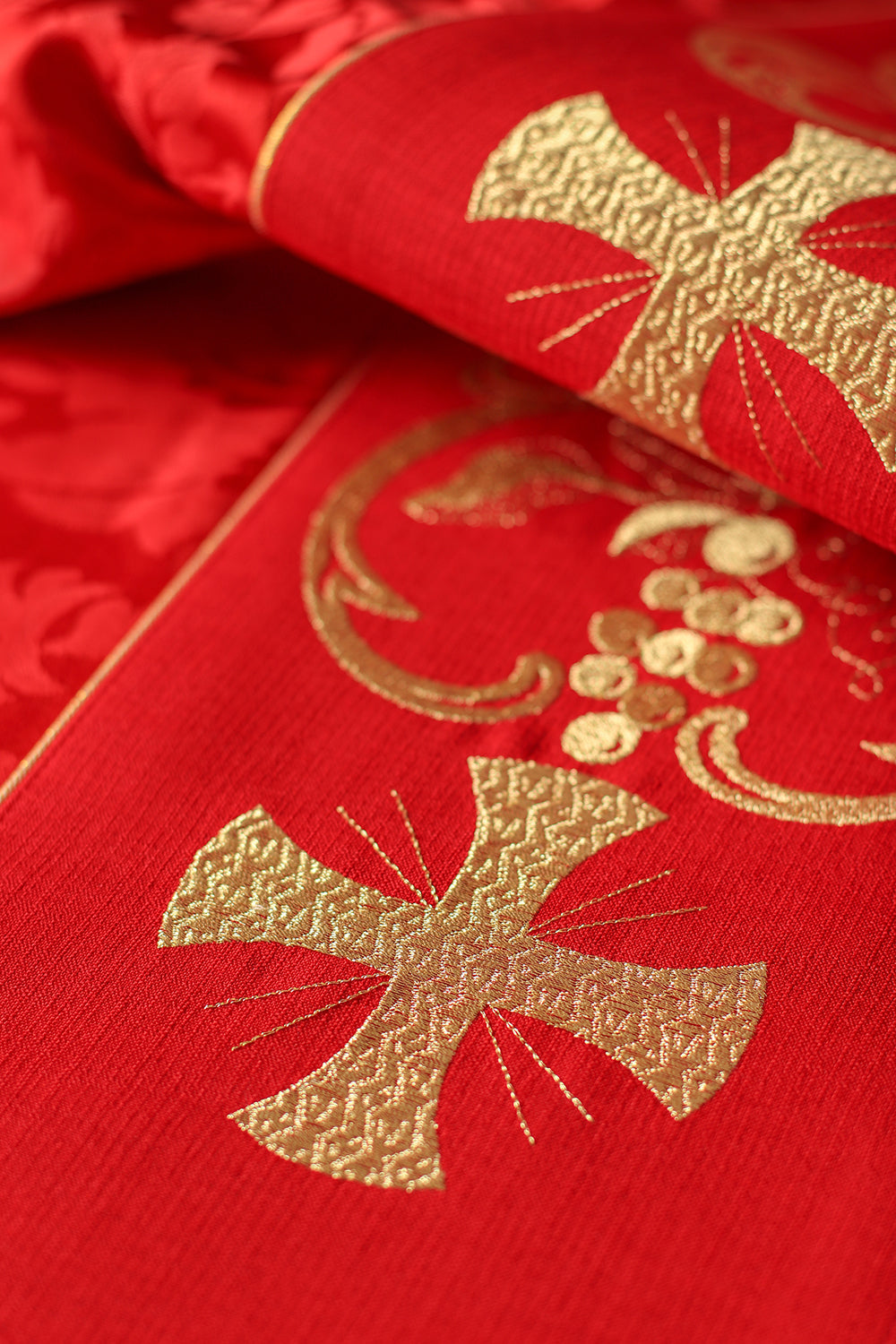 Red liturgical chasuble decorated with embroidered belt