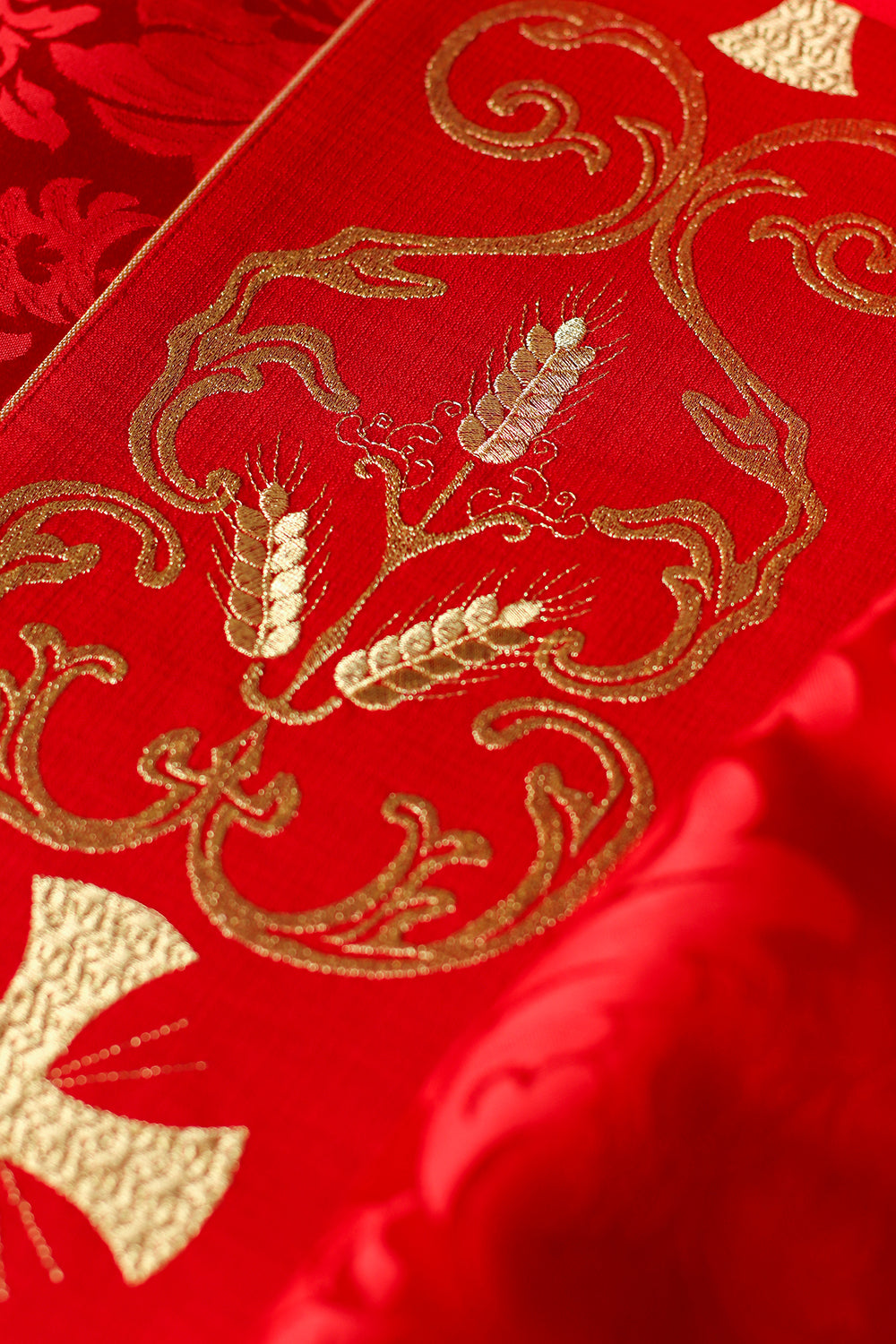 Red liturgical chasuble decorated with embroidered belt