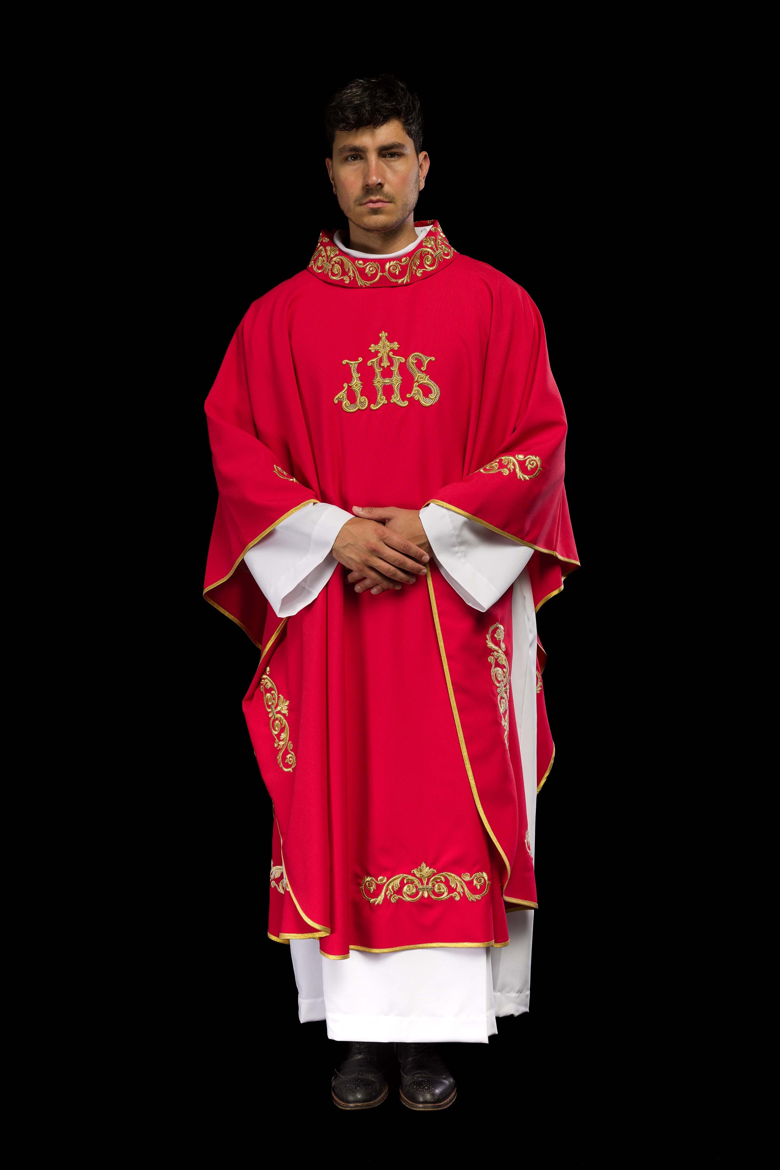 Red chasuble with gold IHS embroidery and decorative trim