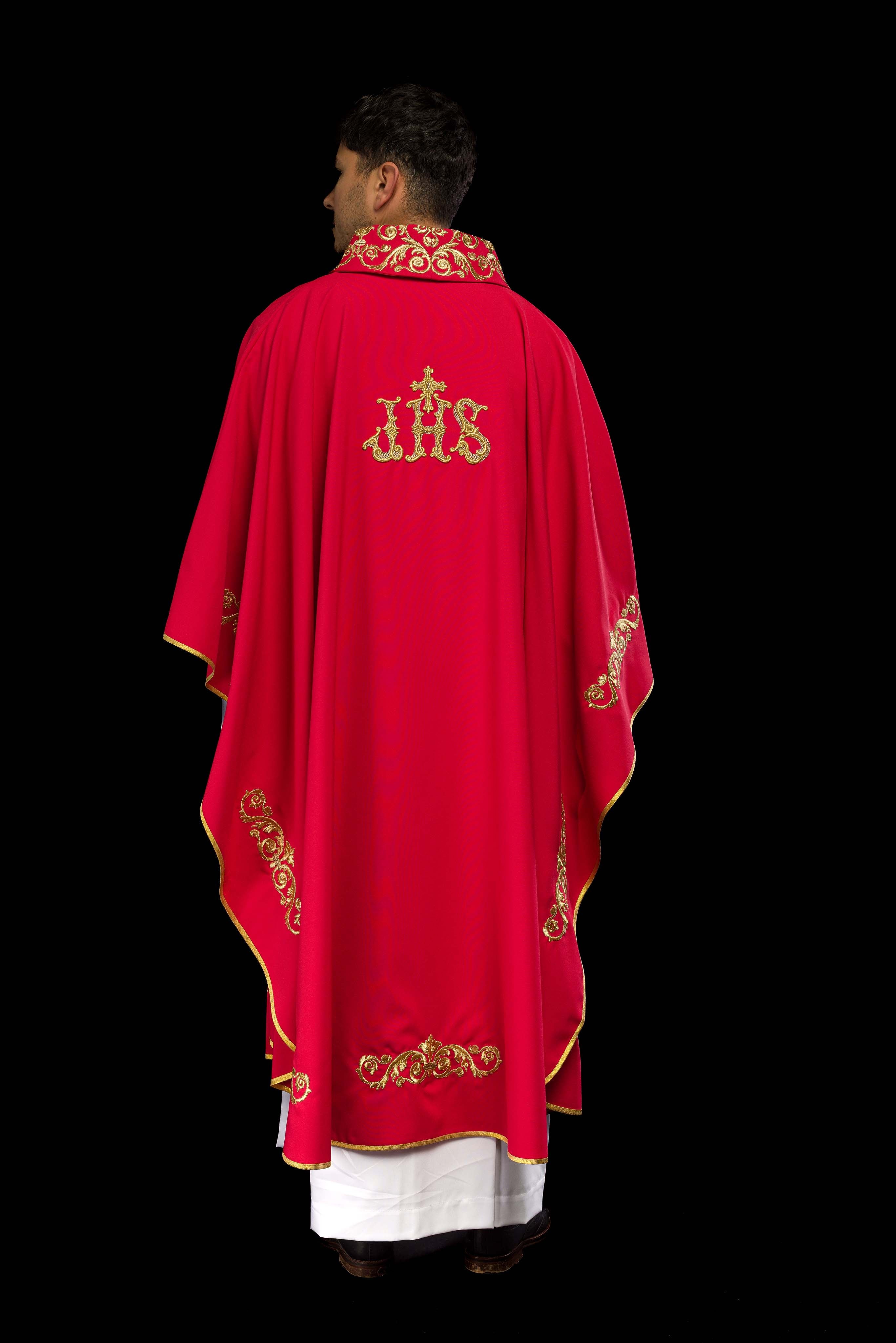Red chasuble with gold IHS embroidery and decorative trim