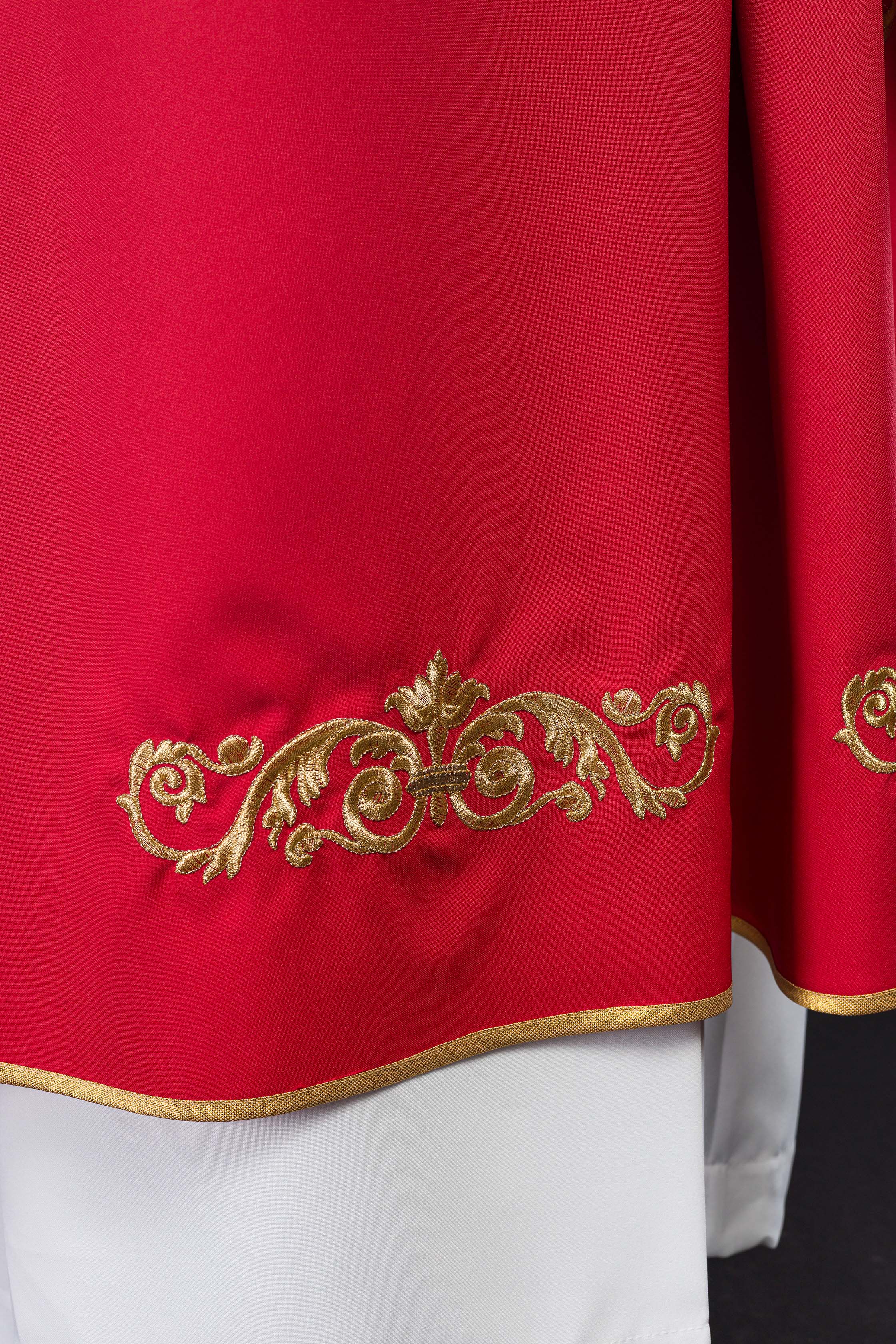 Red chasuble with gold IHS embroidery and decorative trim