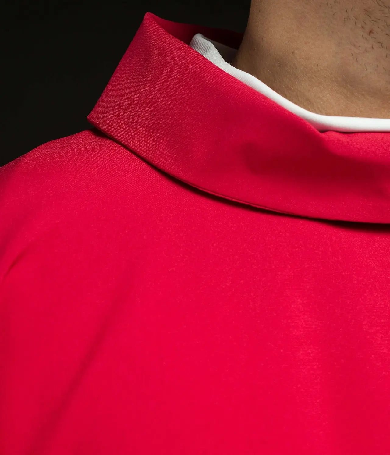 Embroidered red chasuble with JHS symbol