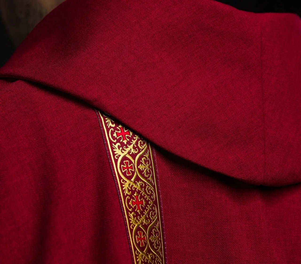 Red liturgical chasuble with embroidered cross and jacquard bands