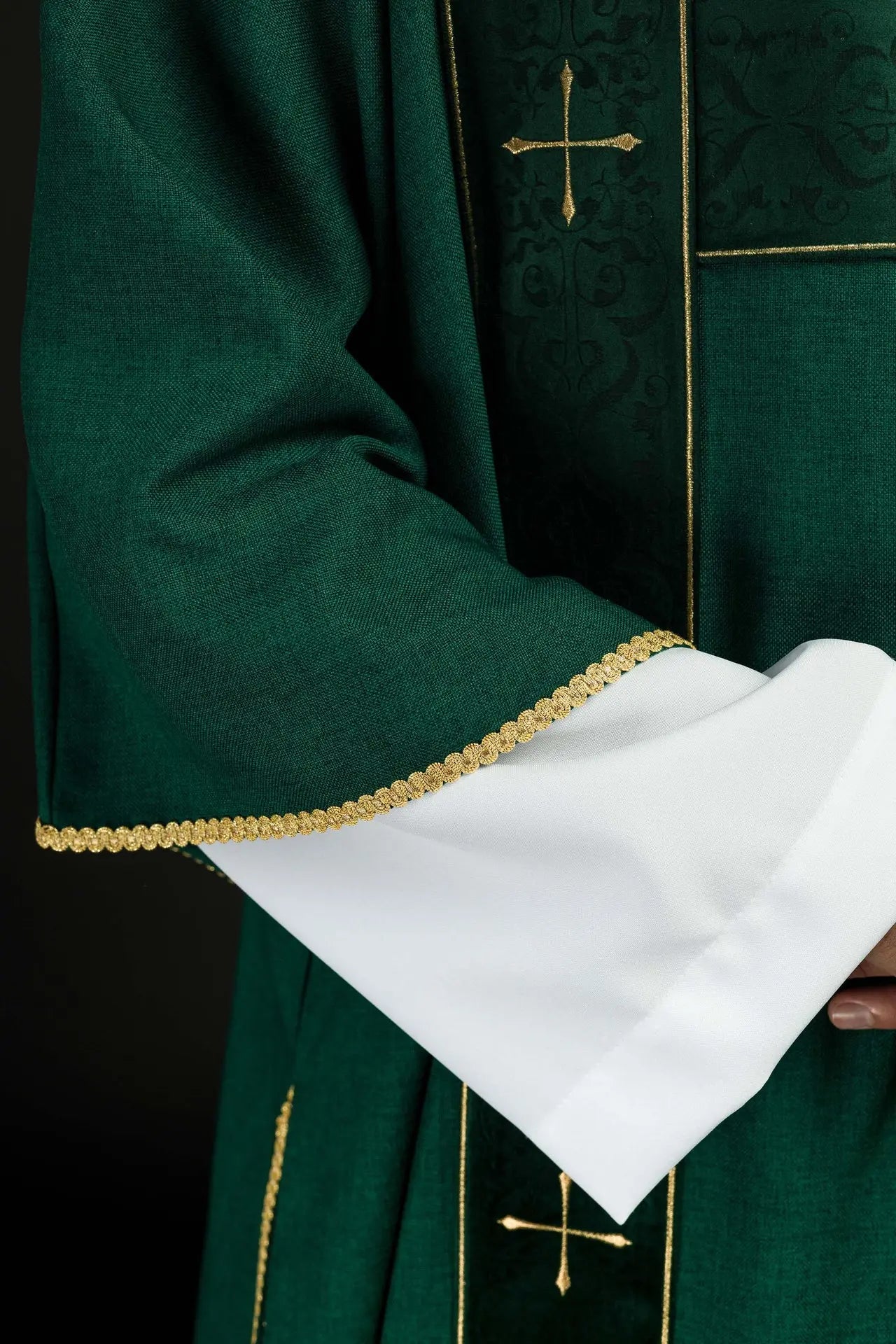 Green dalmatic with velvet stripes and embroidered gold crosses