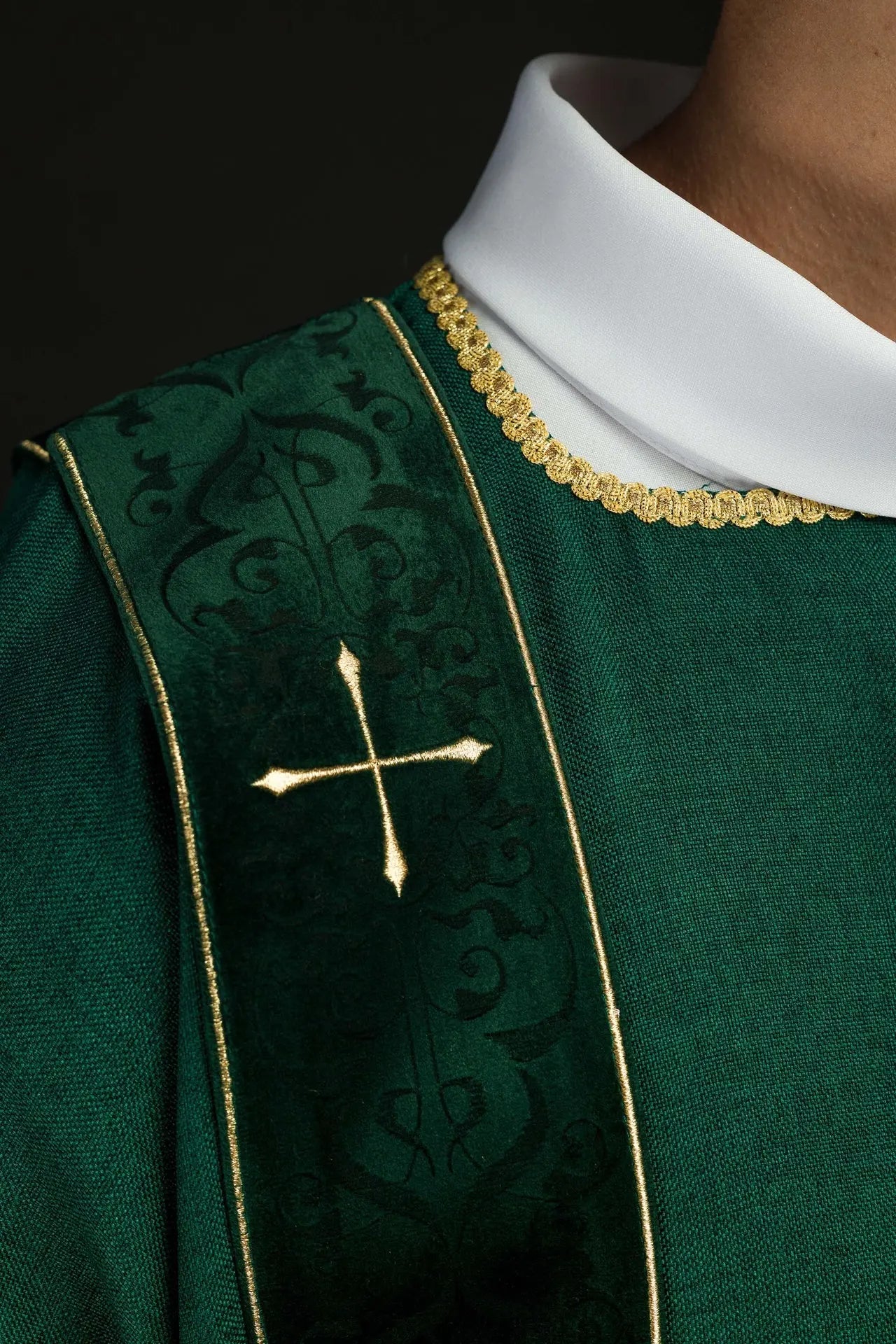 Green dalmatic with velvet stripes and embroidered gold crosses