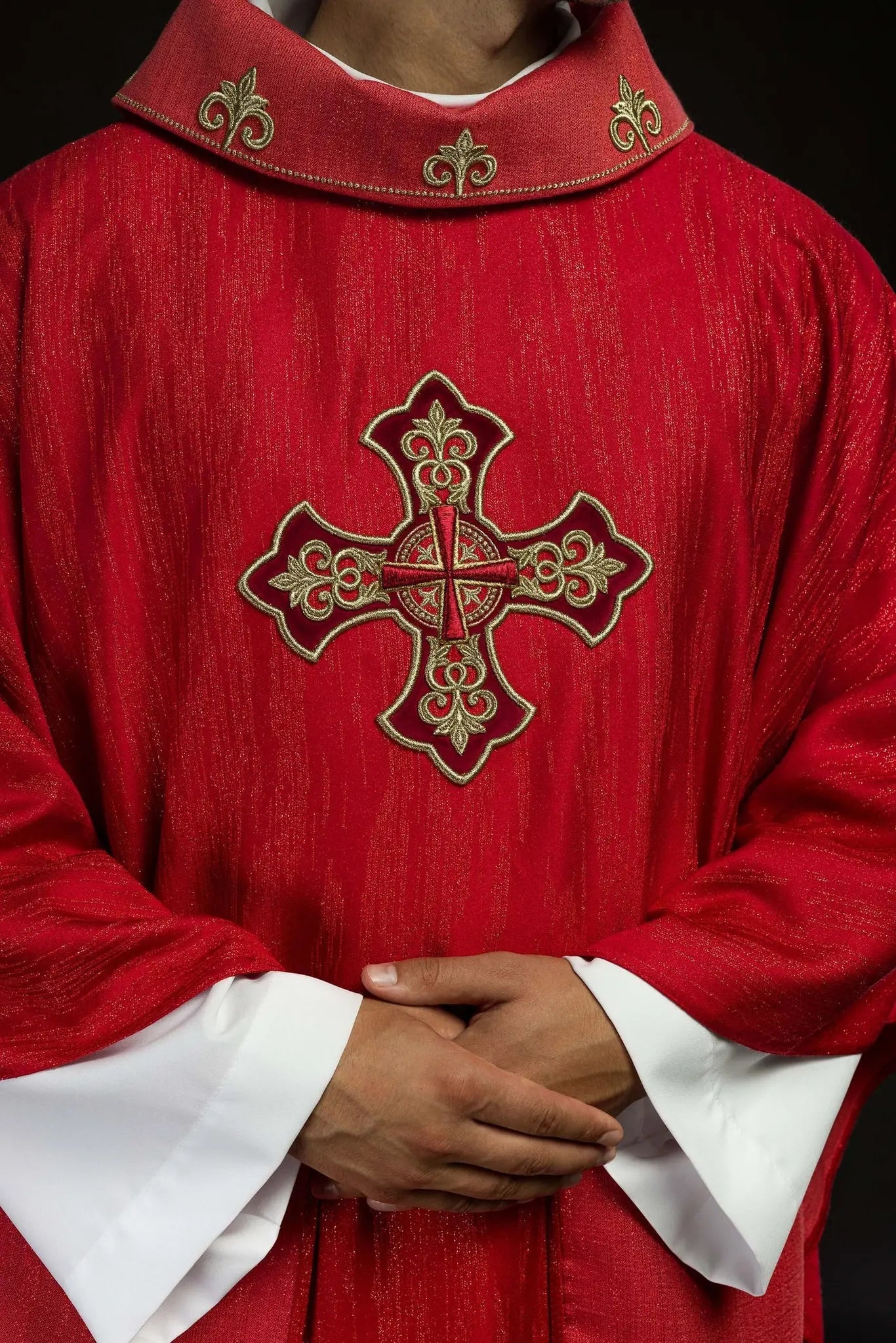Red chasuble with embroidered cross motif on decor