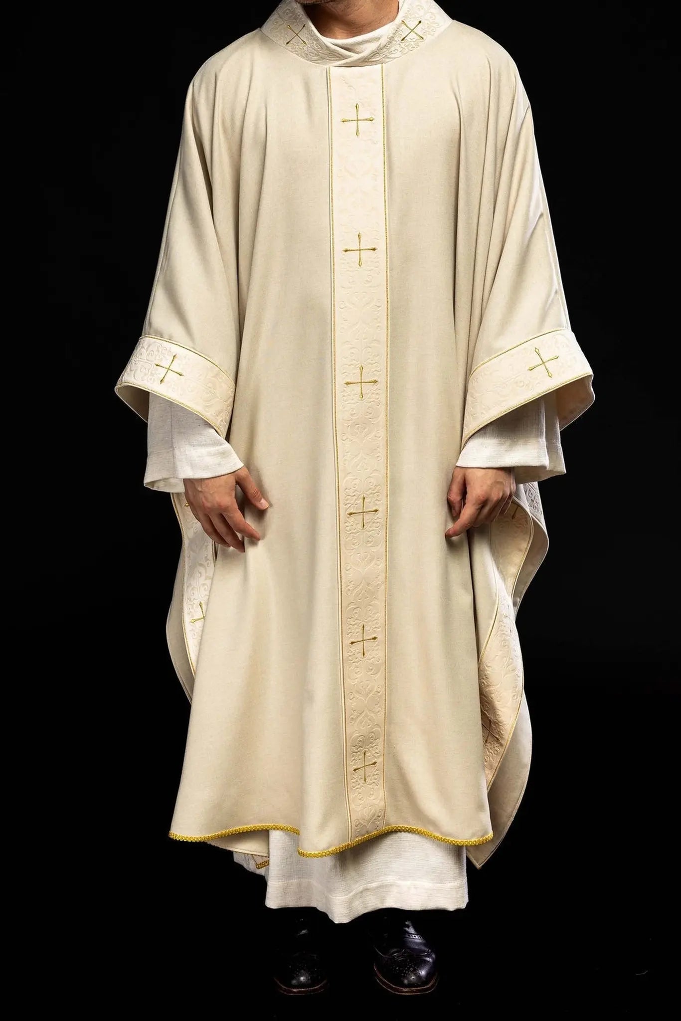 Chasuble in ecru color with an embroidered band and collar decorated with crosses