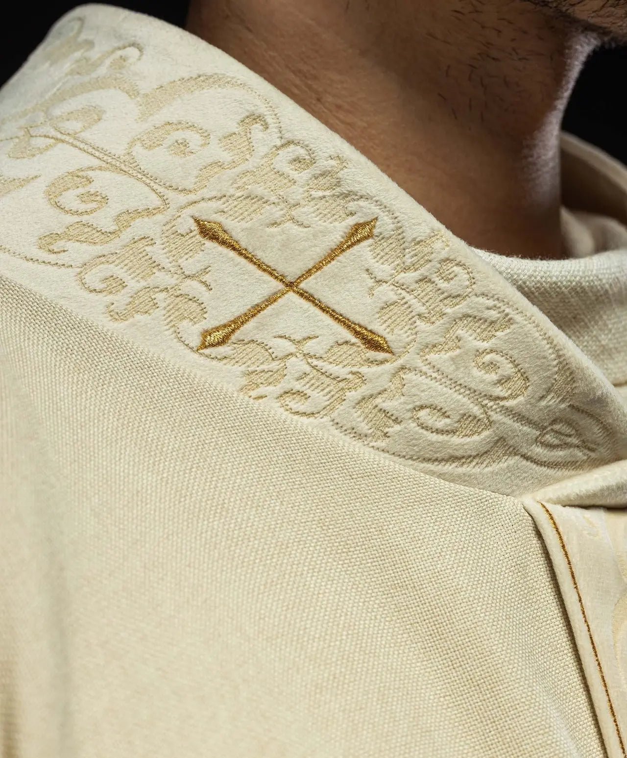 Chasuble in ecru color with an embroidered band and collar decorated with crosses
