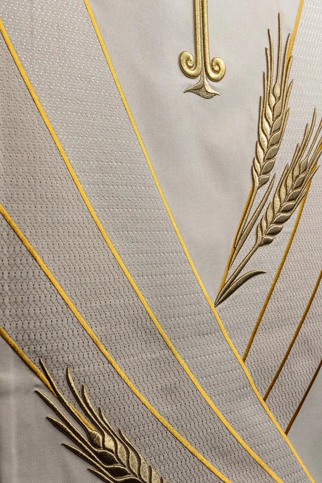 Ecru lectern cover with gold embroidered Chi-Rho symbol (cross with P) and wheat sheaves, suitable for liturgical use.