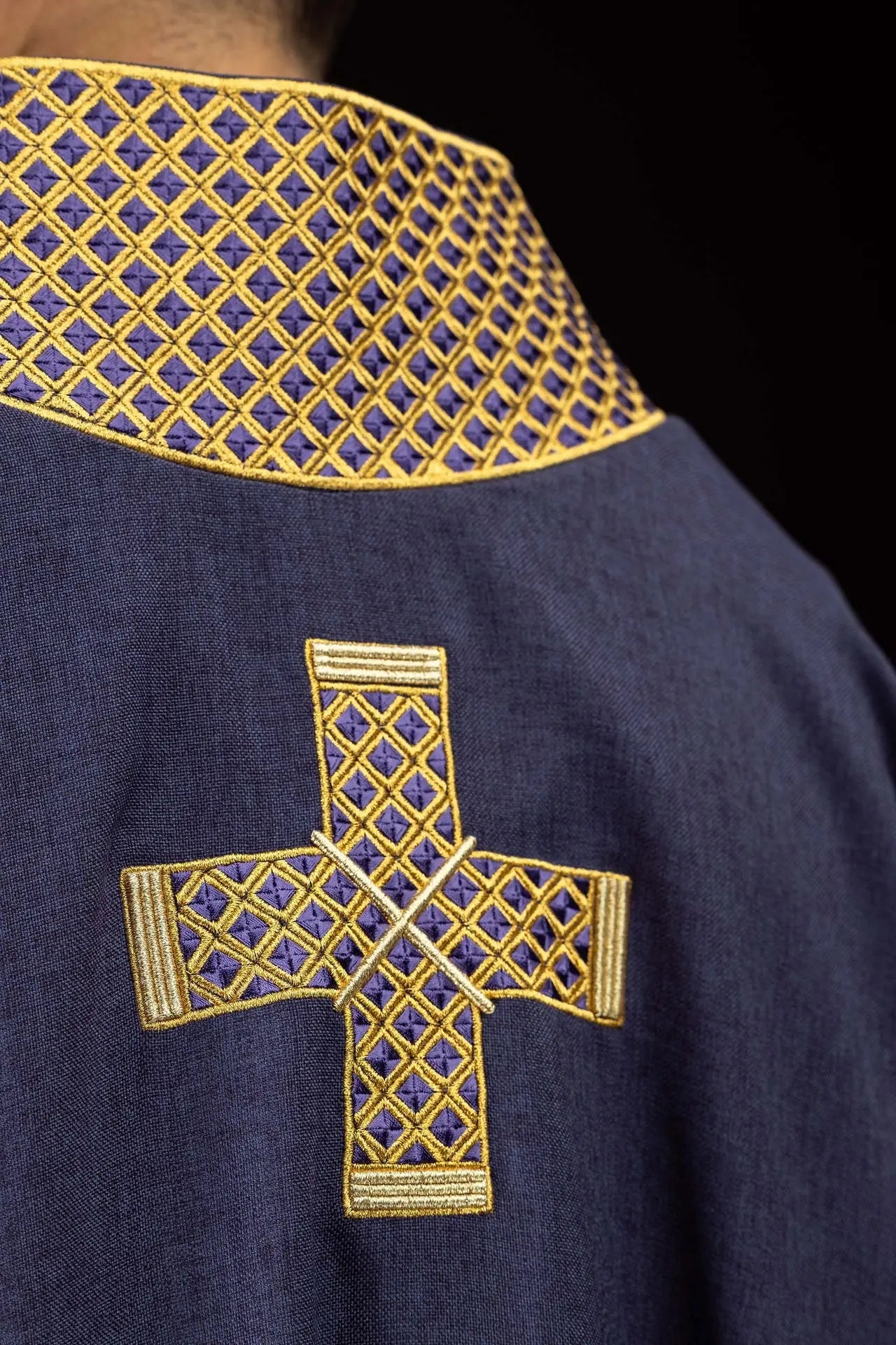 Purple dalmatic with embroidered crosses and collar