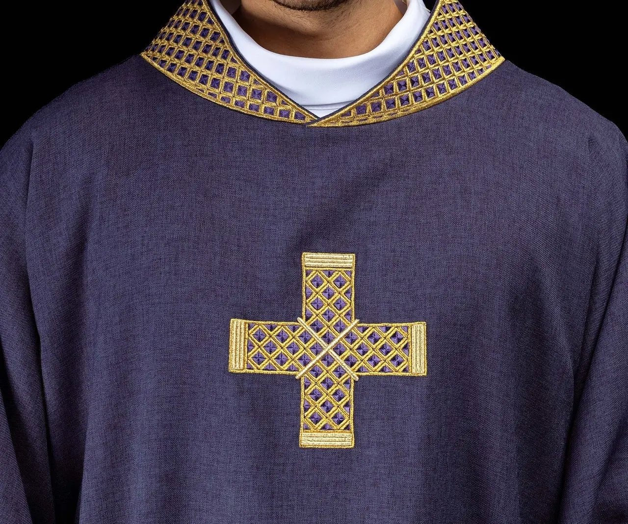 Purple dalmatic with embroidered crosses and collar