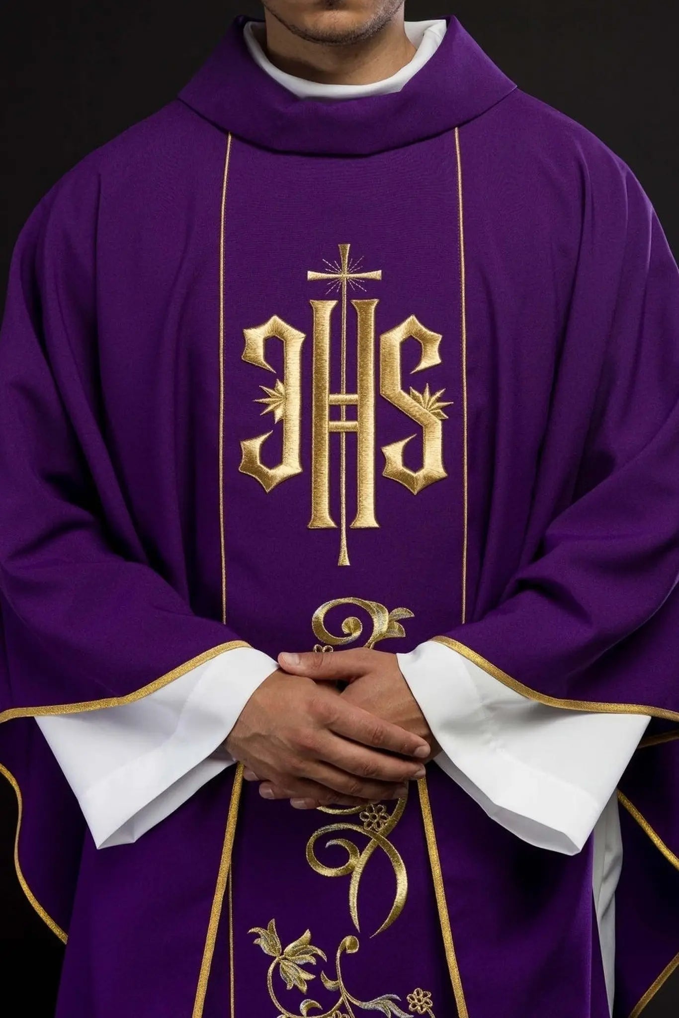 Richly decorated purple chasuble with gold motif and wide IHS band