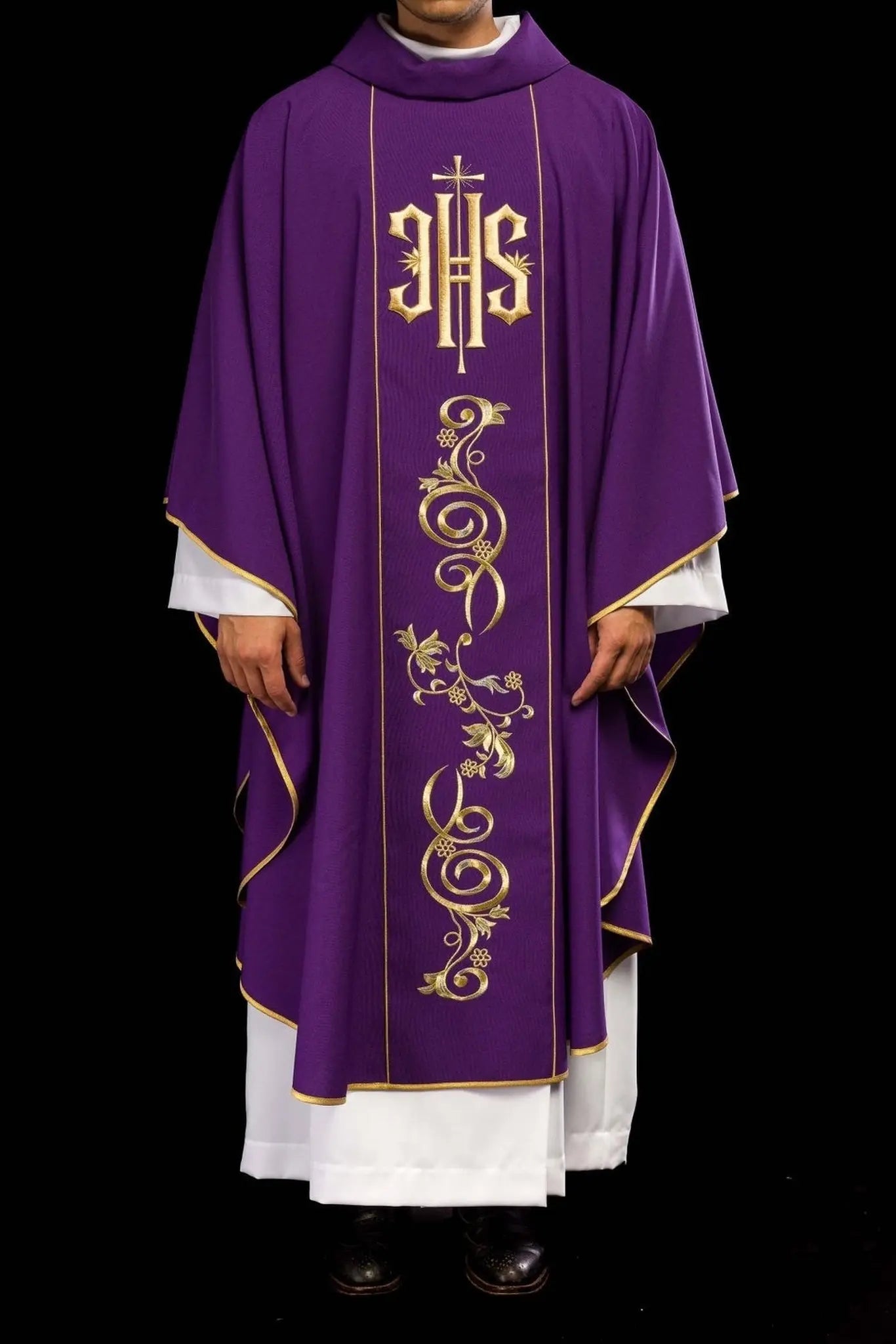 Richly decorated purple chasuble with gold motif and wide IHS band