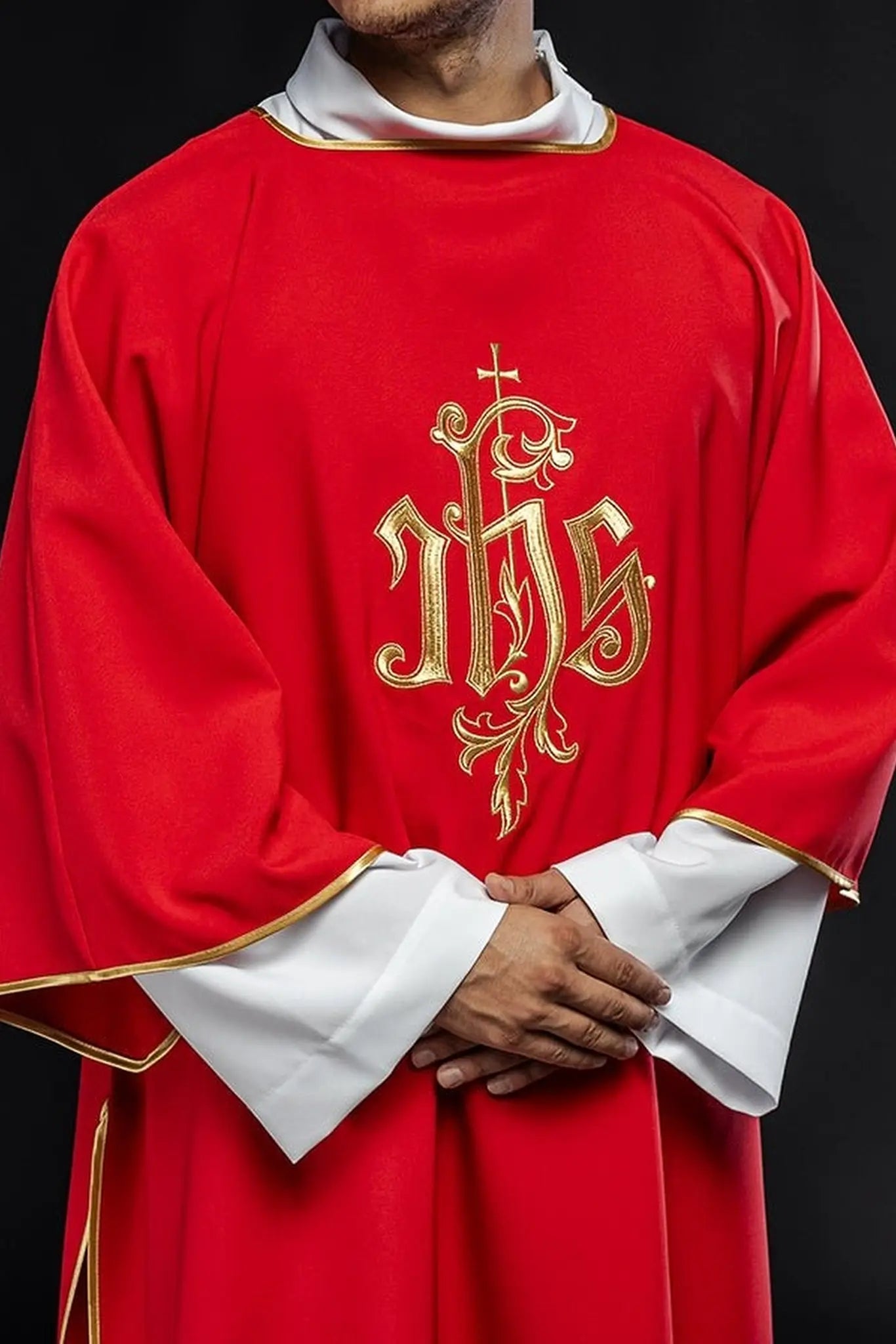 Red dalmatic with embroidered IHS design