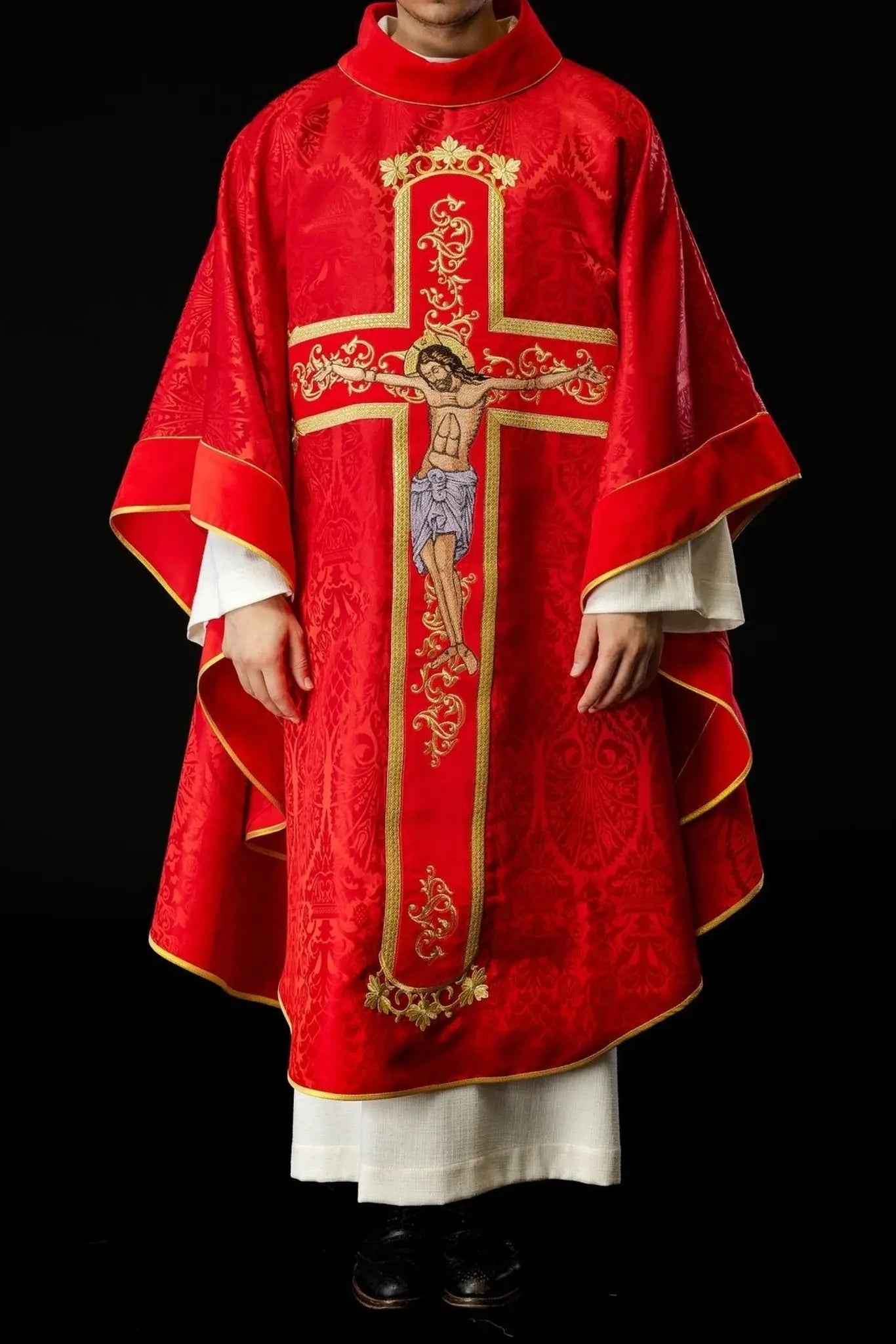 Red chasuble embroidered with the pattern of Jesus Christ