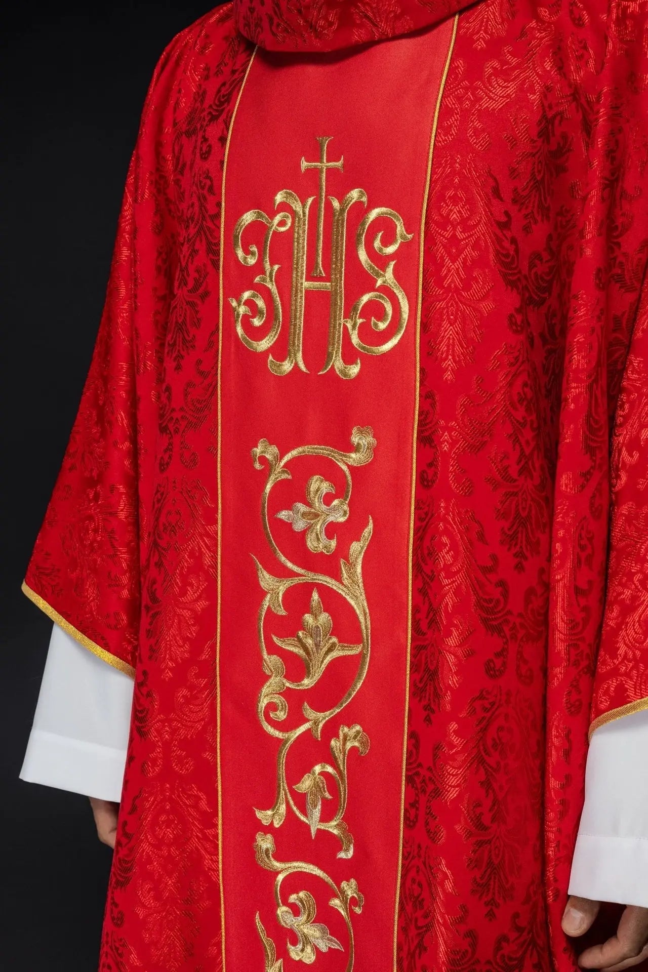 Red liturgical chasuble with richly decorated IHS belt
