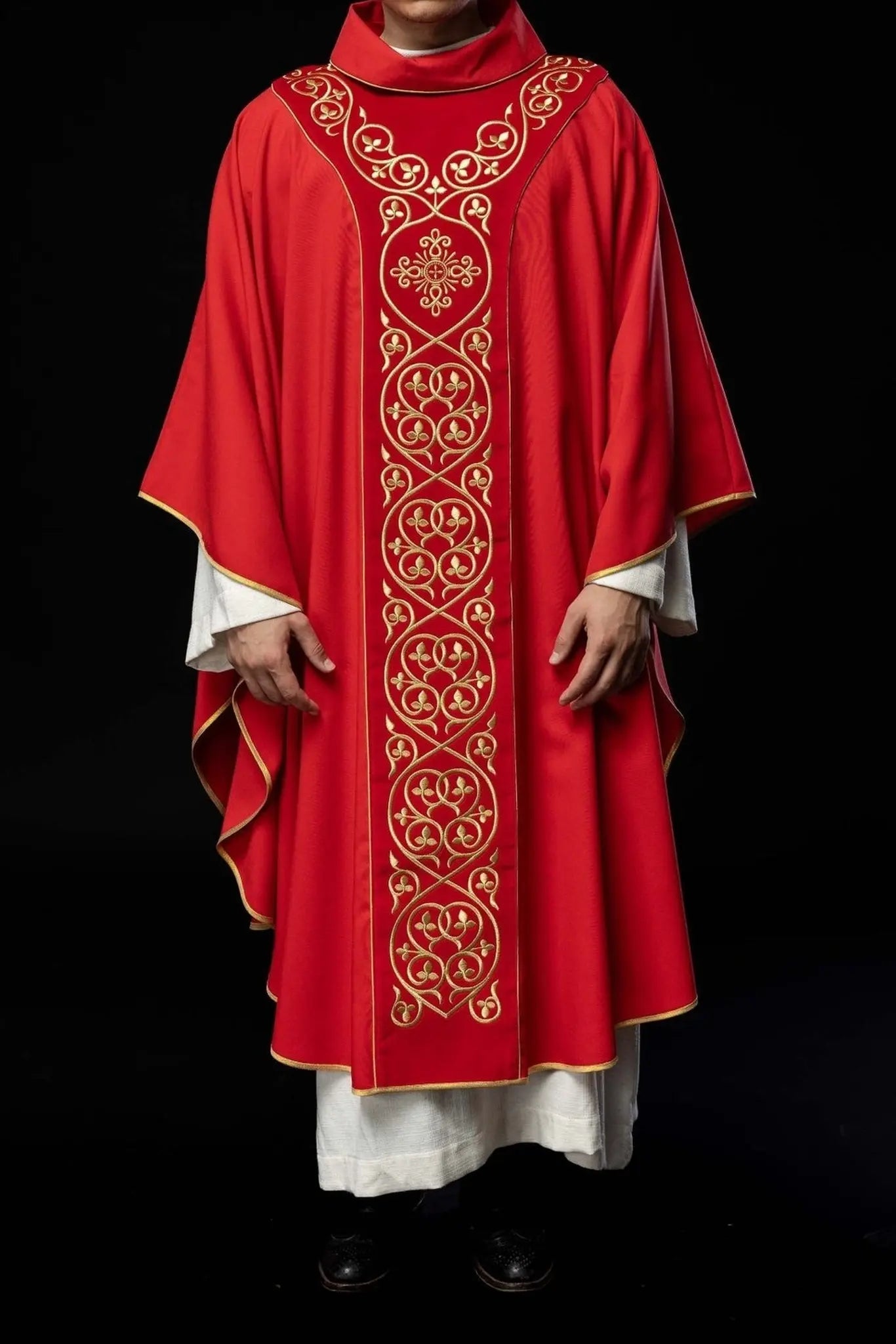 Red liturgical chasuble decorated with embroidery on velvet