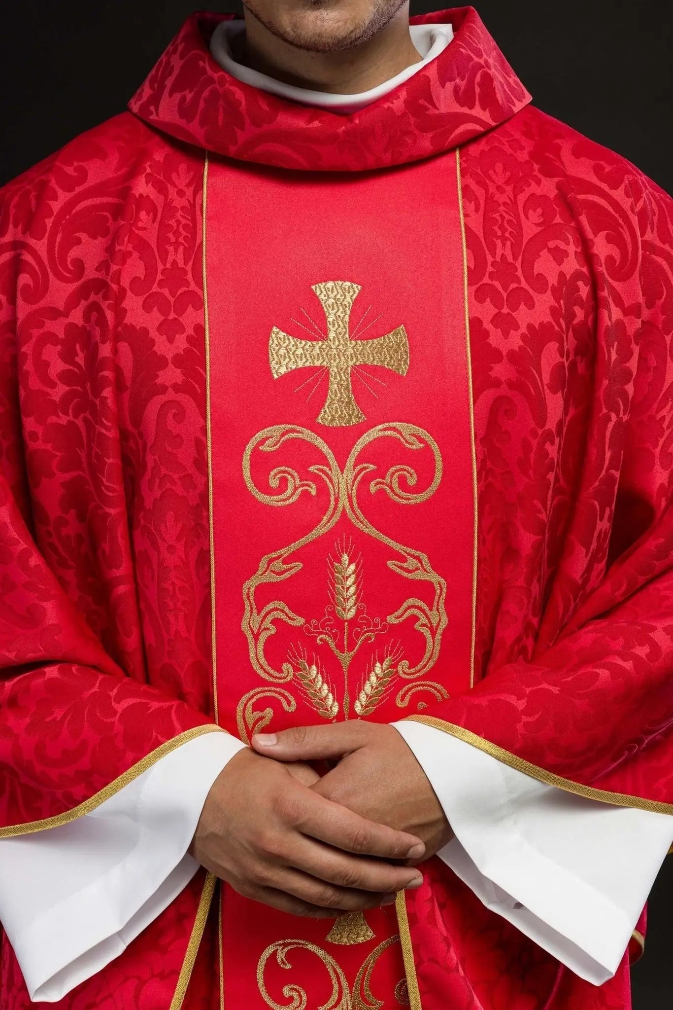 Red liturgical chasuble decorated with embroidered belt