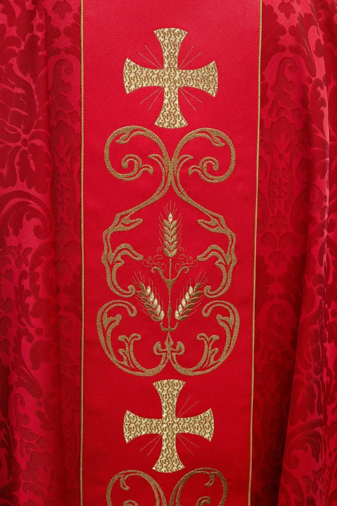 Red liturgical chasuble decorated with embroidered belt