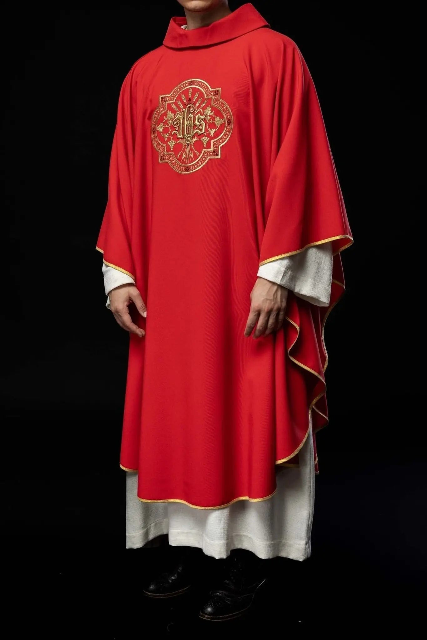 Red chasuble with IHS and PAX embroidery