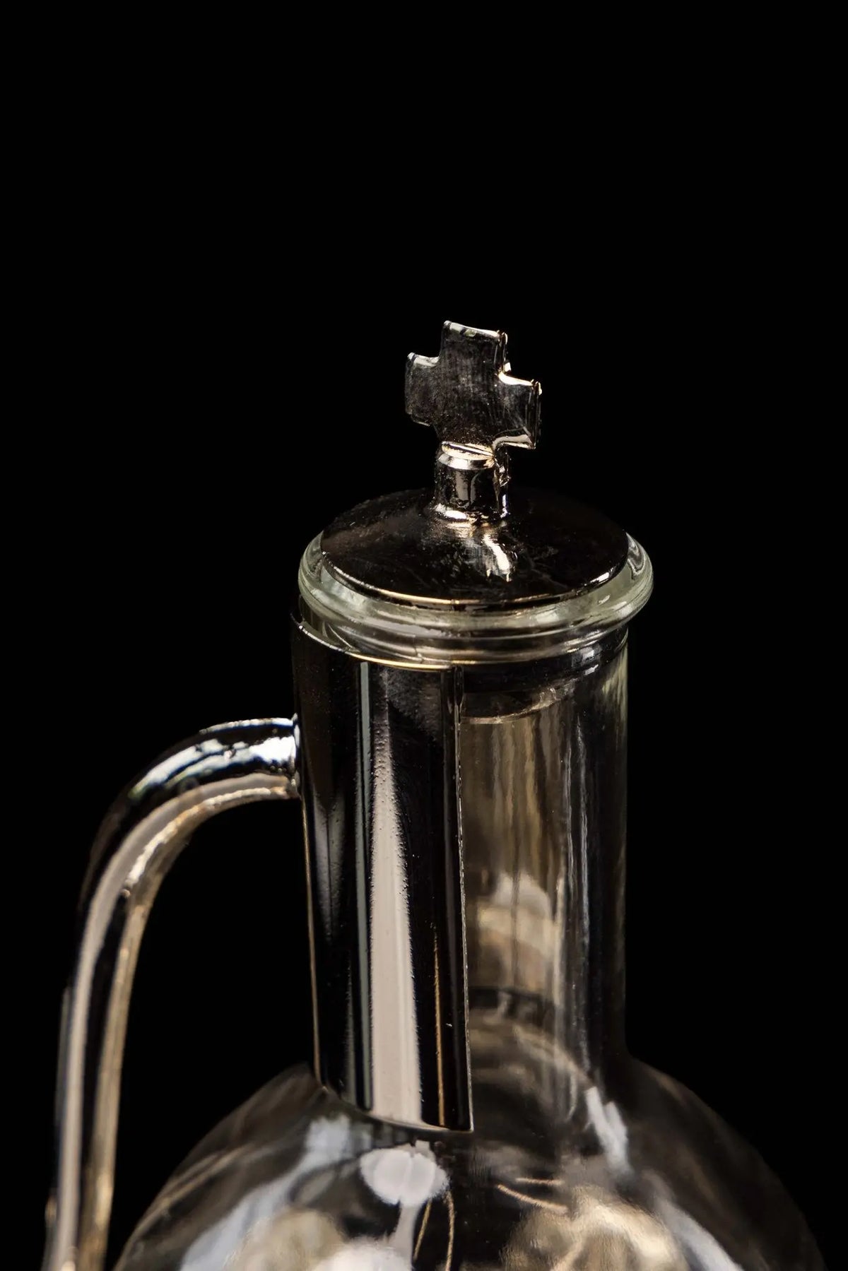 Silver liturgical cruet with cross finial and lid, upper close-up