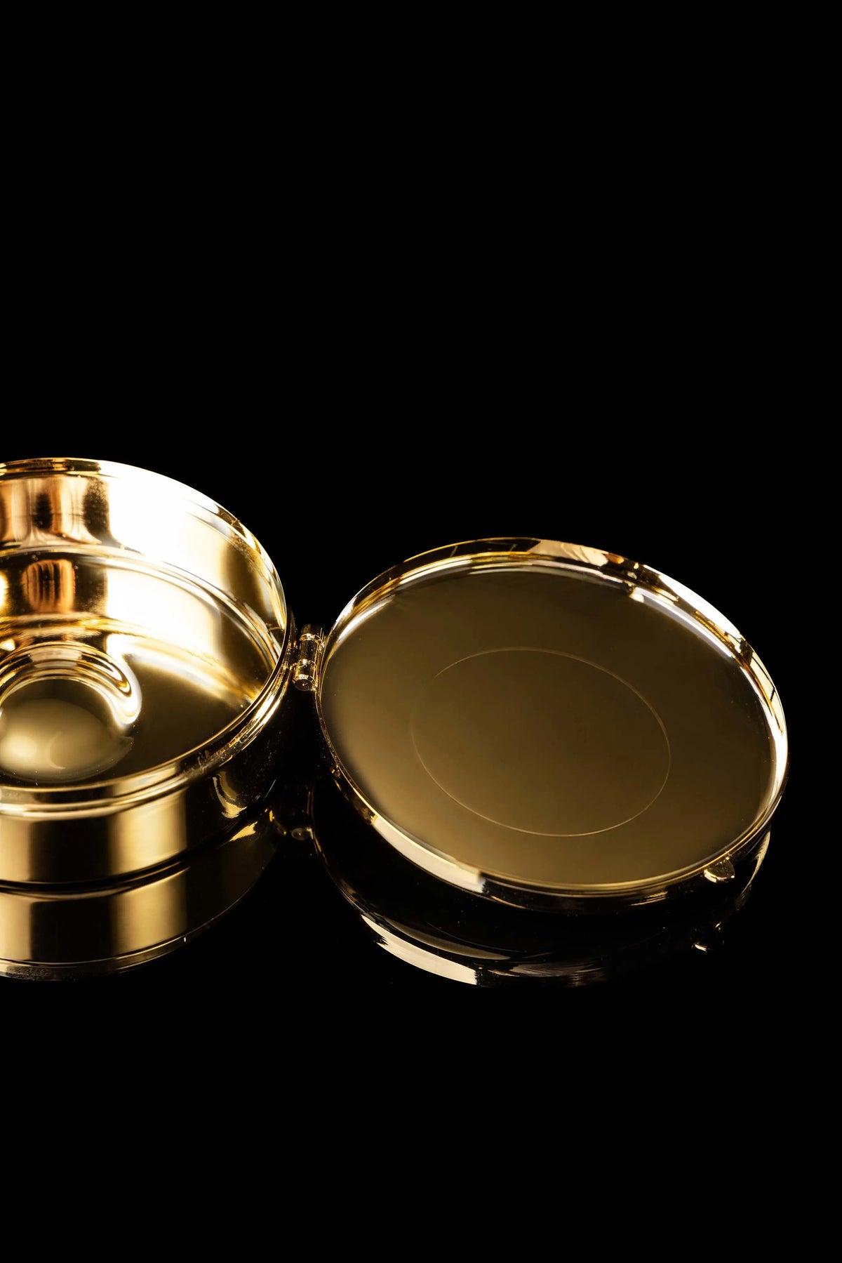 Gold-plated ciborium with engraved IHS, open side view