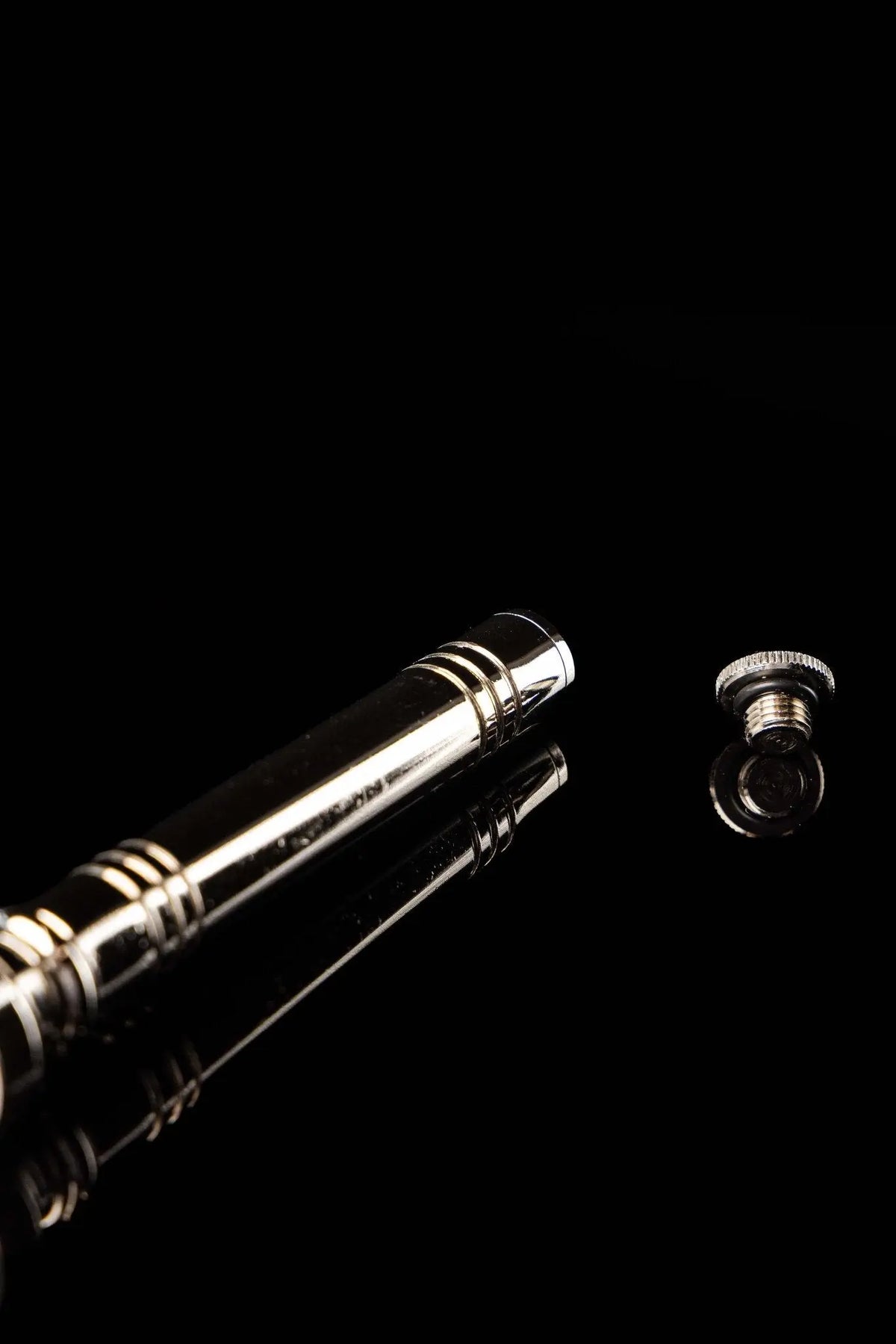 Silver aspergillum with detachable threaded end cap, handle close-up