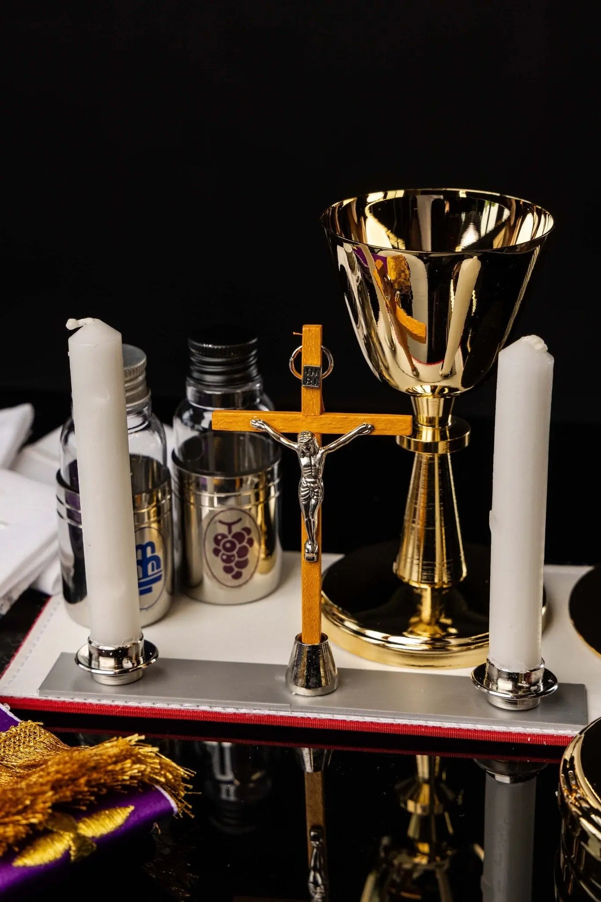Mission case liturgical equipment set, close-up of chalice and candles