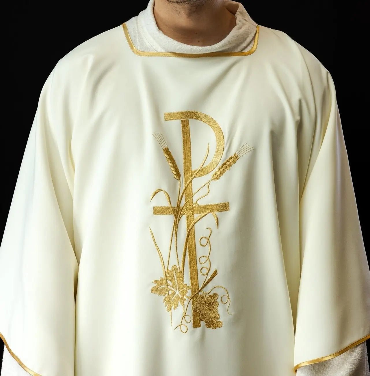 Ecru dalmatica with gold Pax cross embroidery