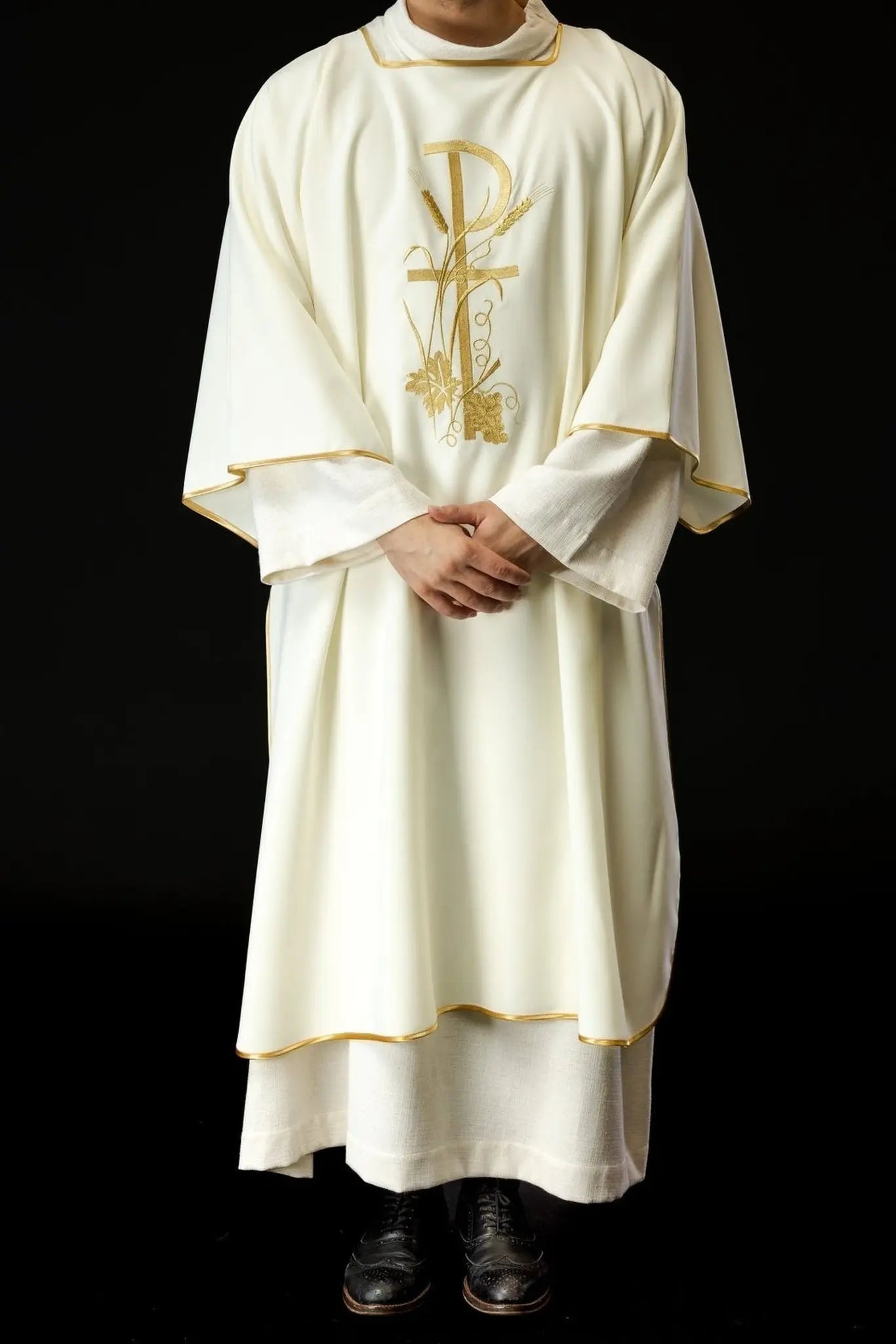 Ecru dalmatica with gold Pax cross embroidery