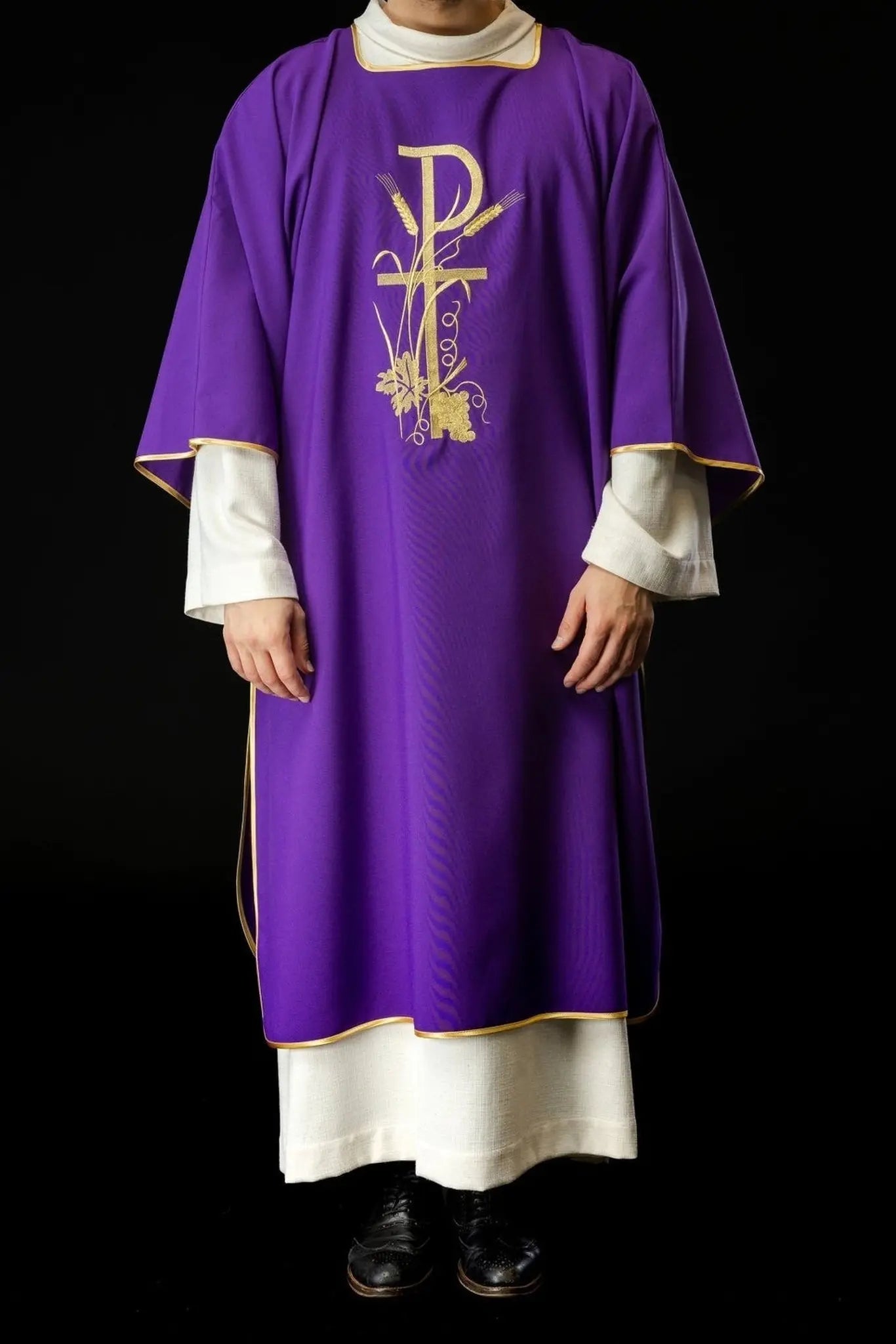 Purple dalmatica with gold Pax cross embroidery