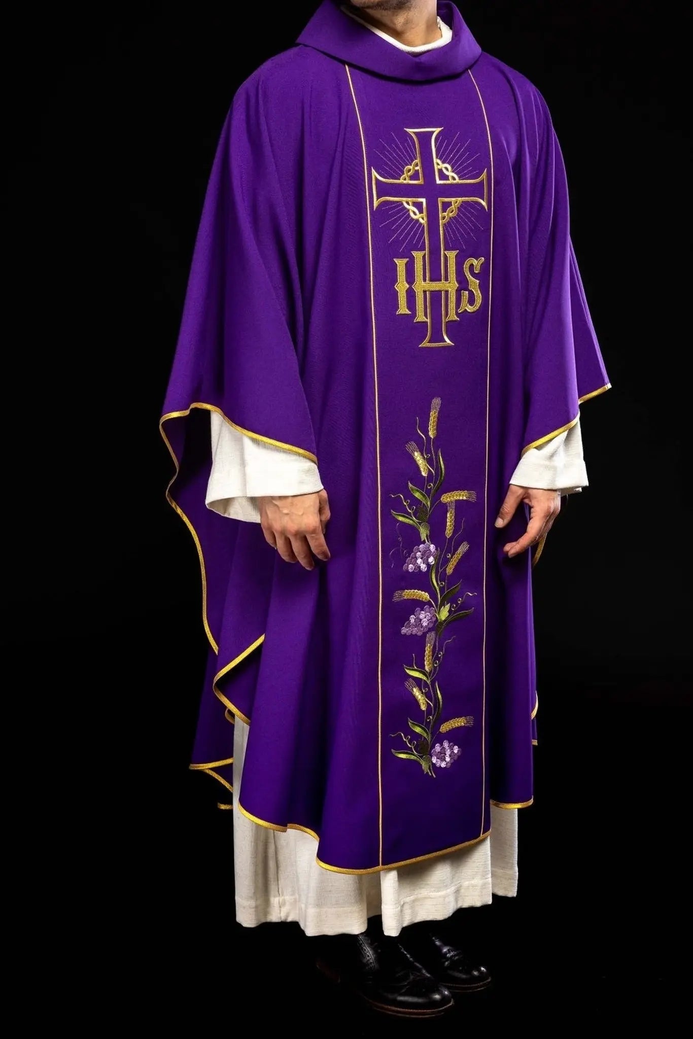 Purple chasuble with decorated gold belt with IHS and ears