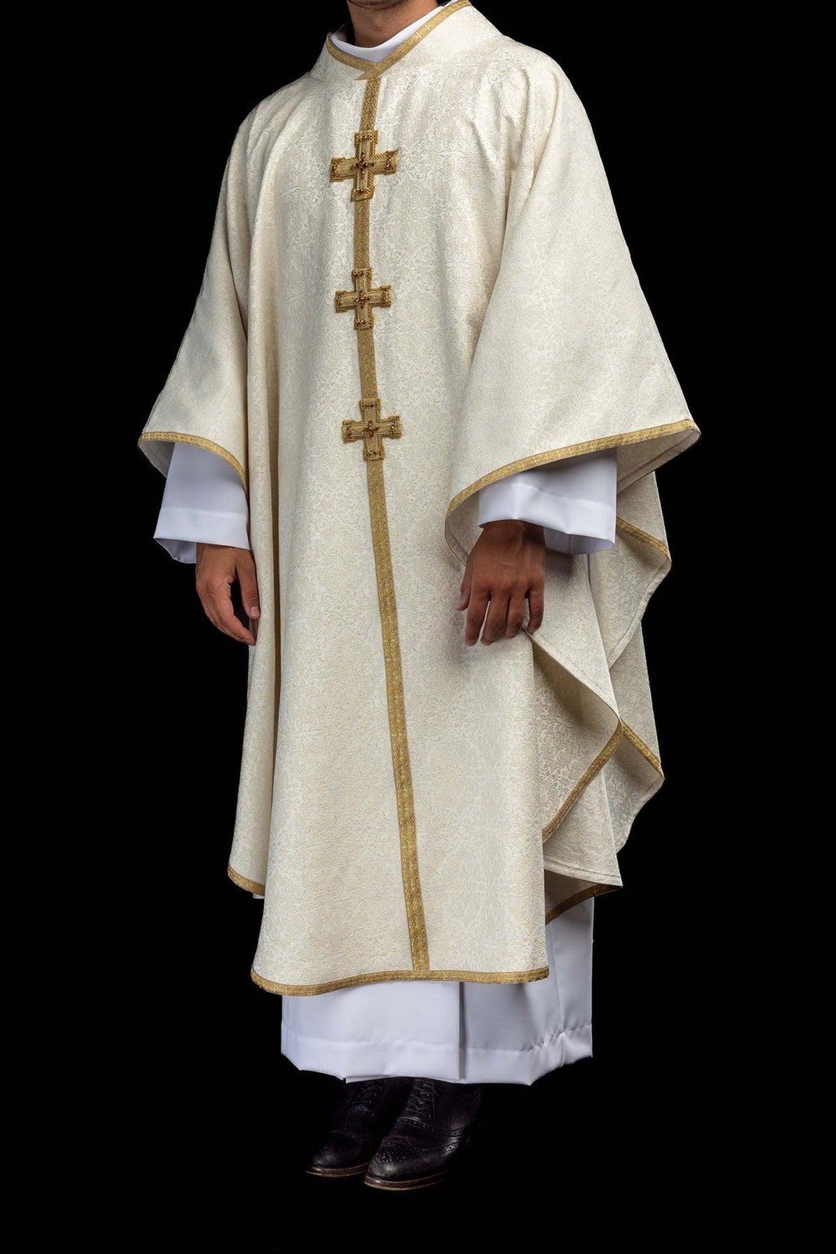 Ecru chasuble with dimensional crosses and natural stones, worn front view