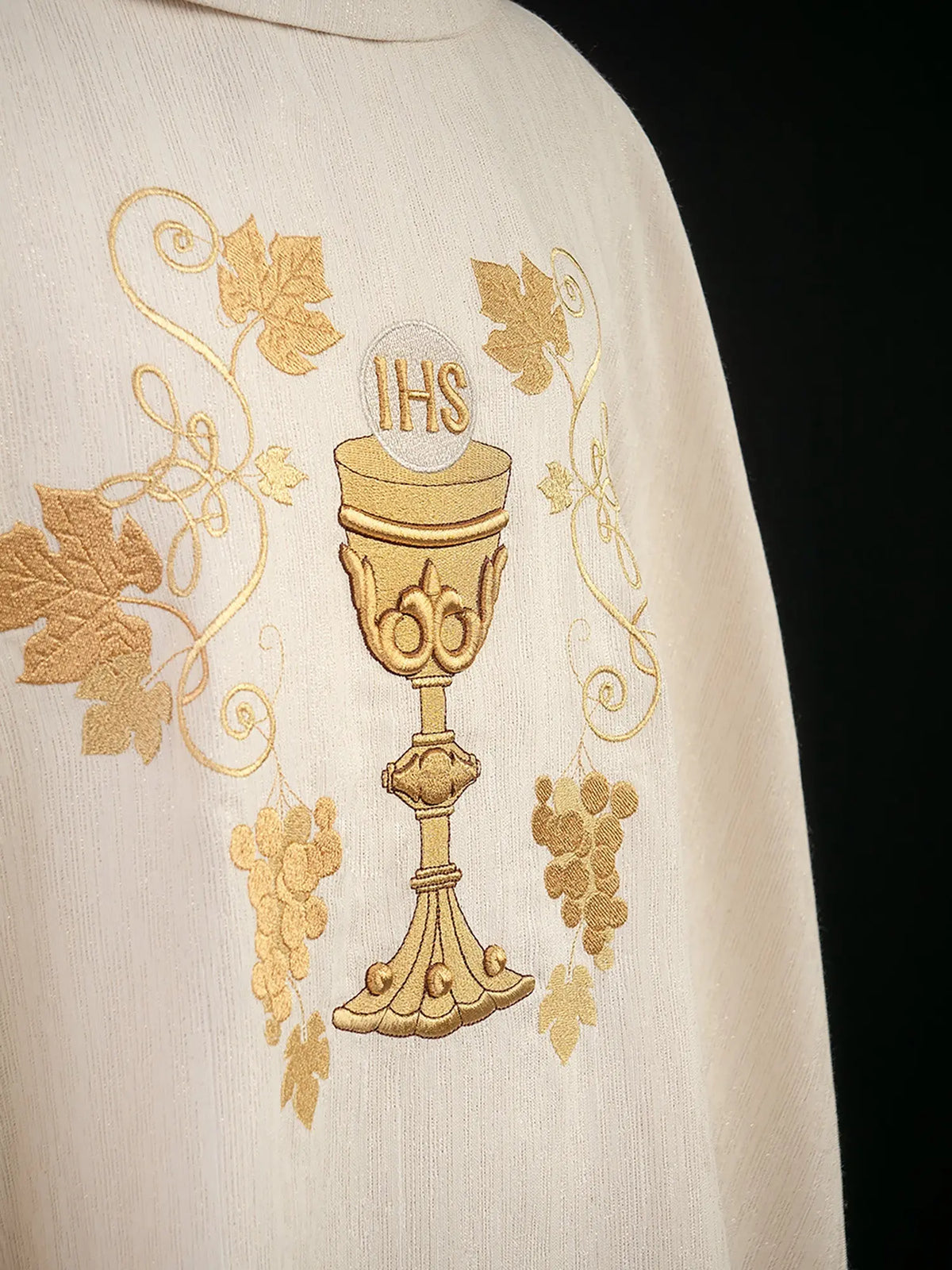 Ecru chasuble with chalice and vine embroidery, close-up view