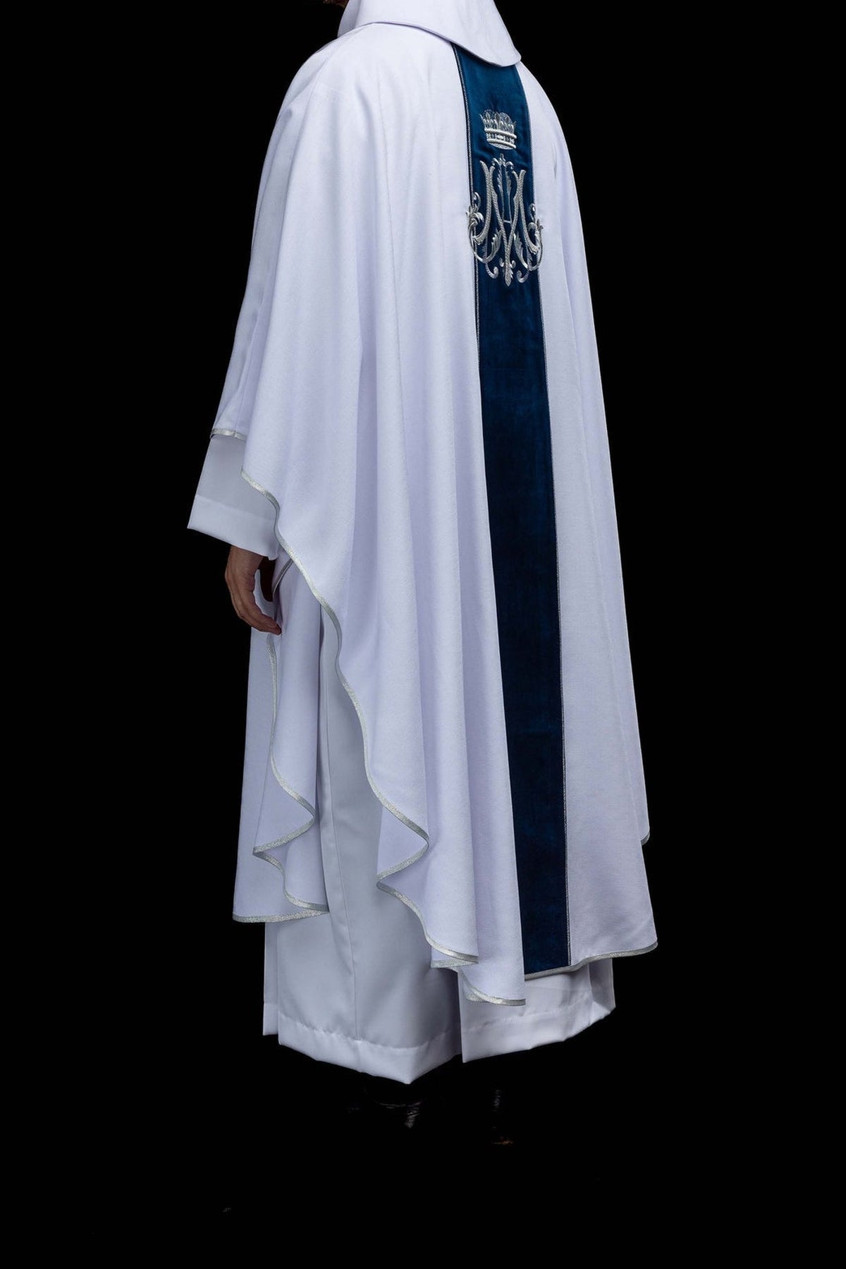 White chasuble with embroidered crowned Marian monogram, back view