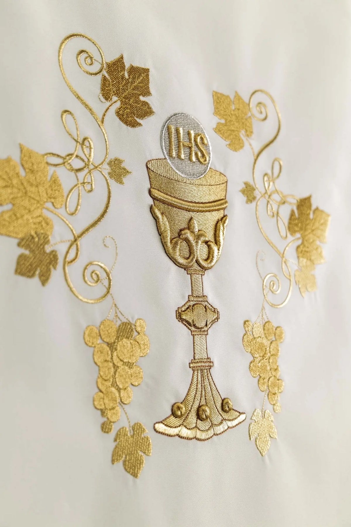 Ecru lectern cover with gold chalice, grapes, and vine embroidery, detail view