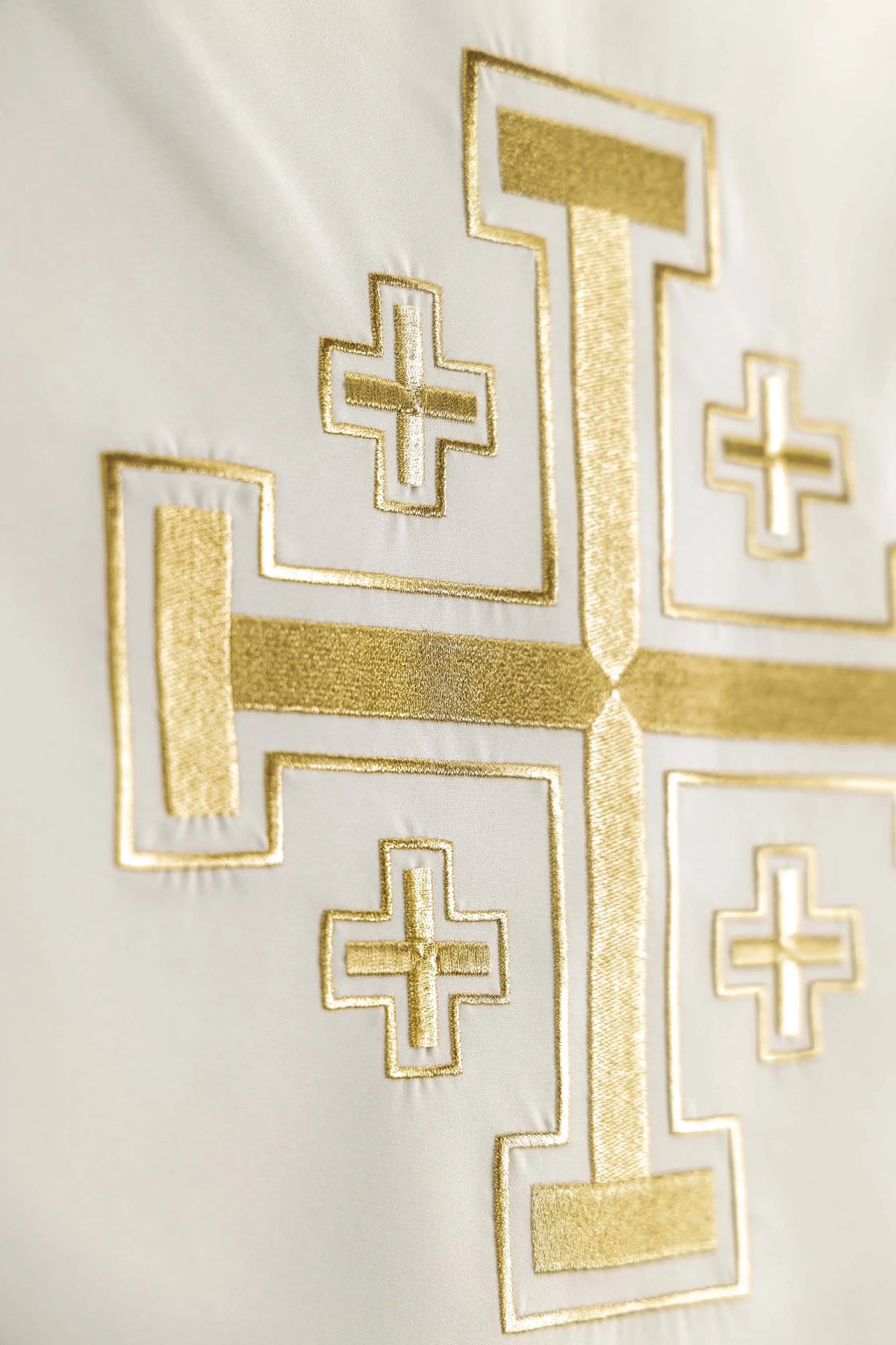 Ecru lectern cover with gold Jerusalem cross motif, close-up view
