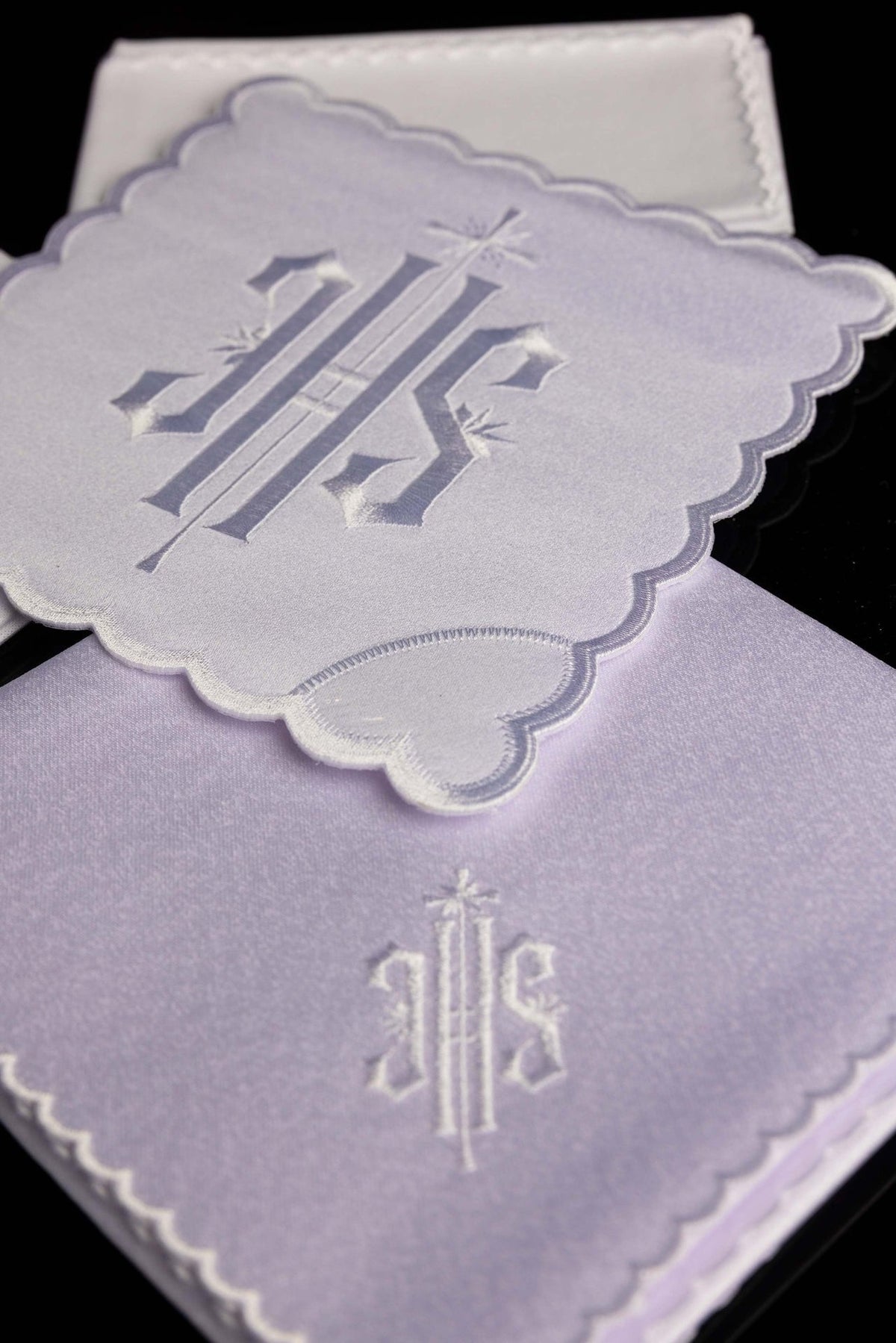 White altar linen set with IHS embroidery, angled close-up