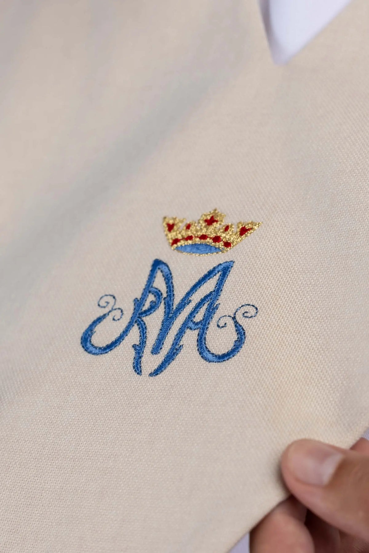 Ecru lector's scapular with embroidered Marian monogram, worn front view