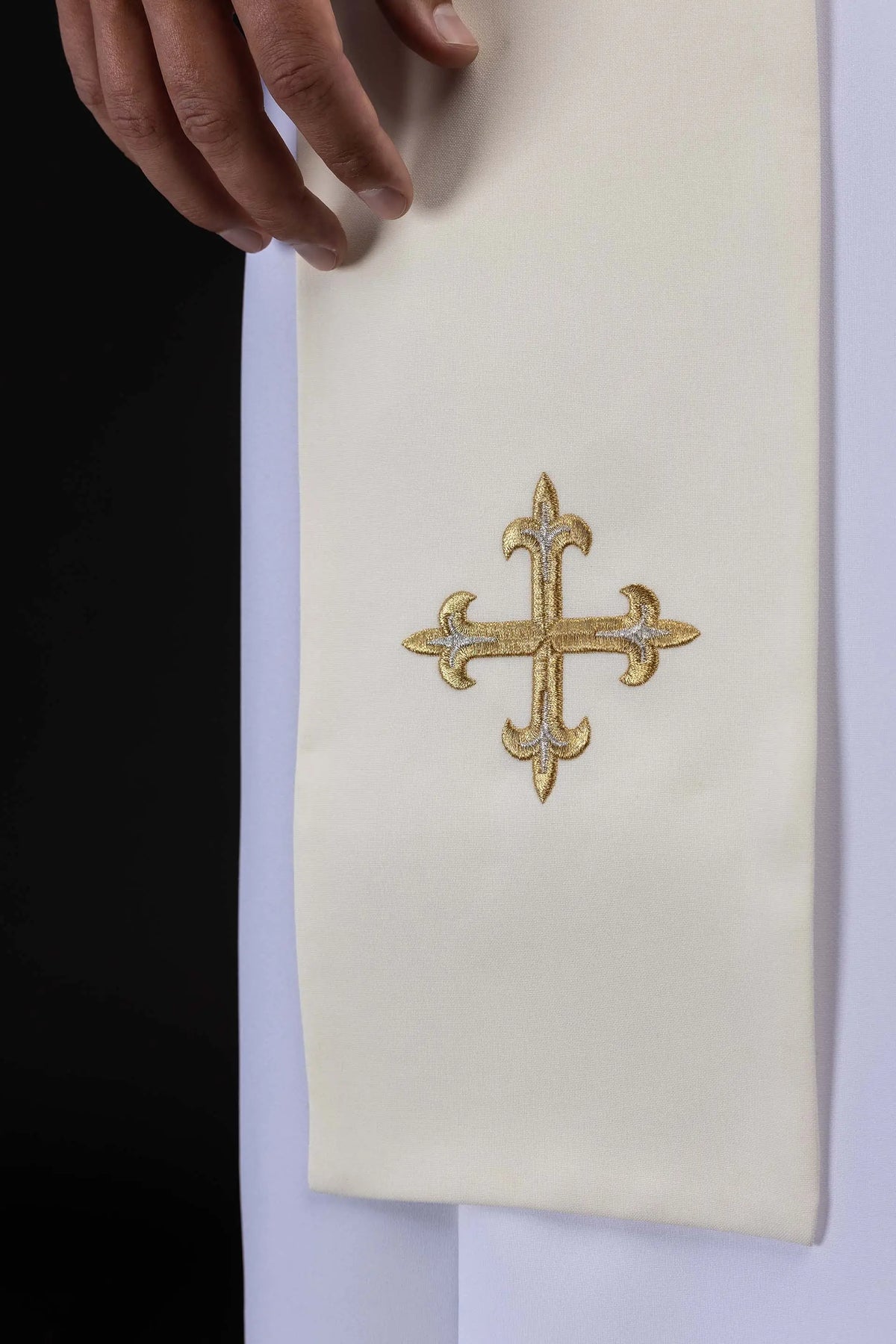 Ecru stole with embroidered gold cross, lower end close-up